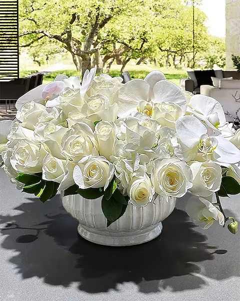 Pacifico - Peaceful in Italian is Pacifico. This beautiful arrangement of roses, orchids and hydrangea will create a sense of calm in any environment. Part of our Lux category, when only the best will do.  All prices in USD ($)