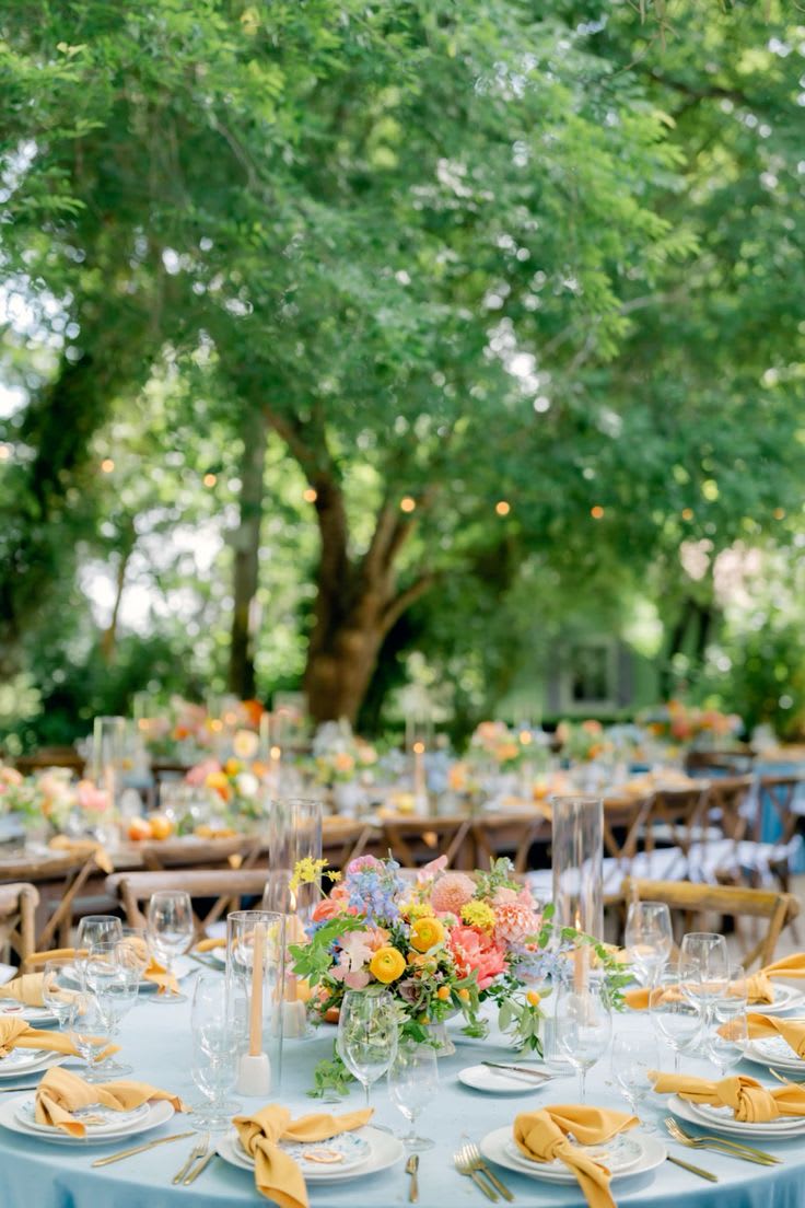 Gala Centerpieces for large round table - Details: Compote Vase 8 inch wide,  Round Table for 8-12 guests per table 4 arrangements minimum per order  Color of flowers TBD