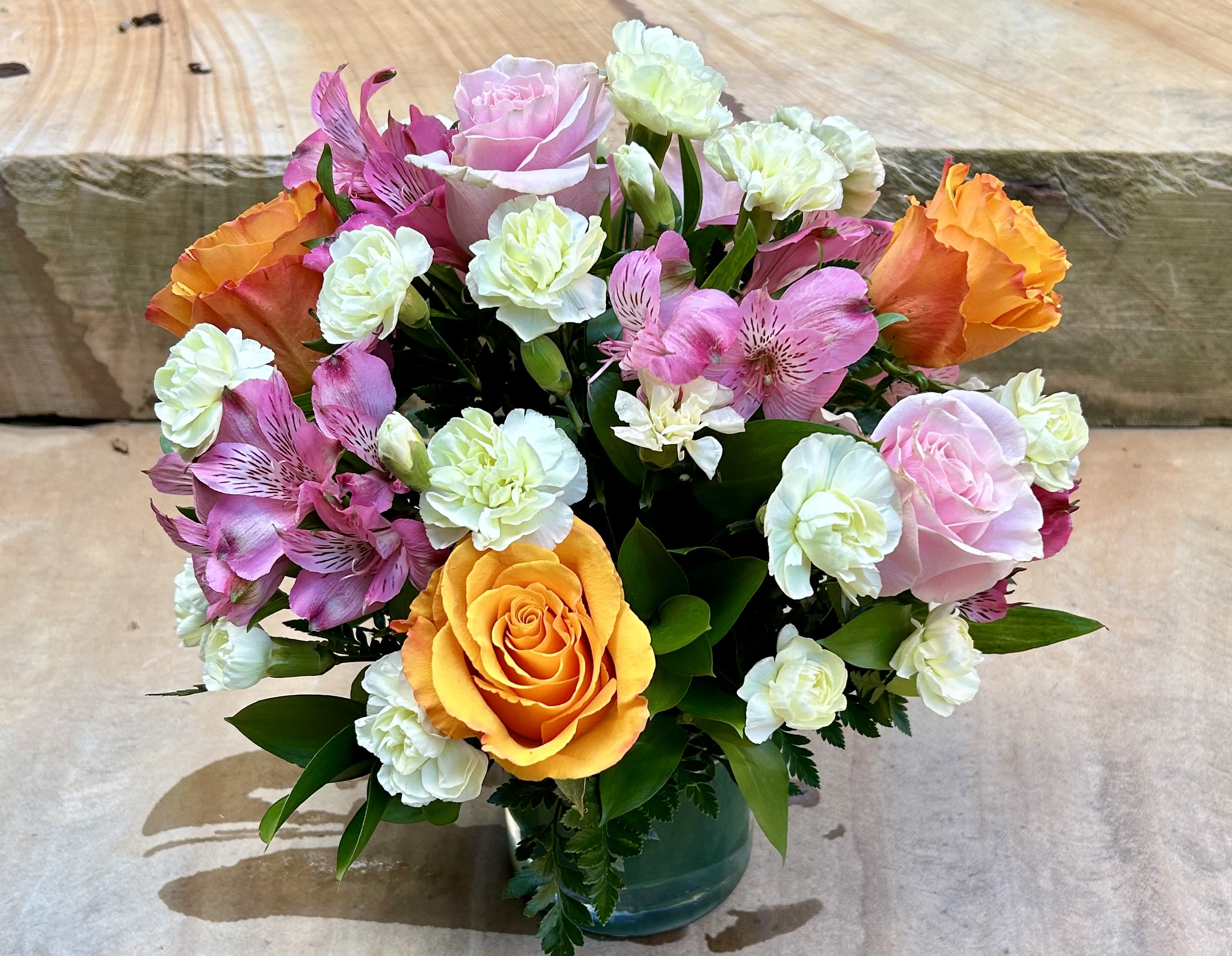 Lime Sorbet - A spring colored bouquet of mini carnations, alstroemerias and roses in a low glass vase. 