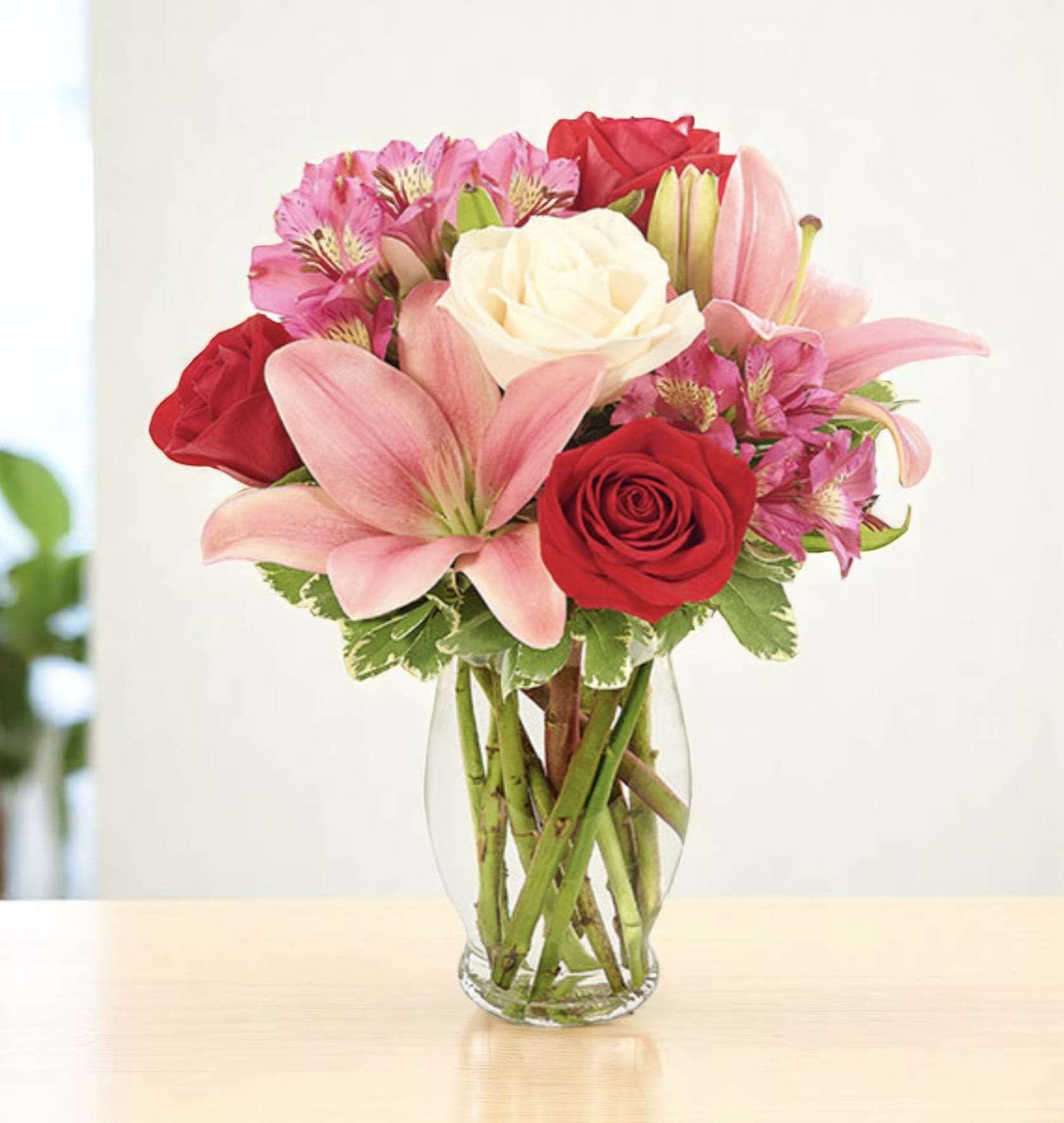 Love Is In The Air Love Is In The Air - Yes, love is in the air and in the heart of both you and your special someone as you share this uncommonly beautiful bouquet! Asiatic lily, roses and alstroemeria are crafted together so perfectly, so gracefully, in a clear fluted vase. Elevate every moment with our fresh flower delivery service. Meticulously crafted by expert florists, each bouquet arrives fresh and vibrant. Whether for a birthday, anniversary, or a simple gesture, we bring beauty straight to your door. Order today and experience seamless delivery with unmatched elegance and freshness.