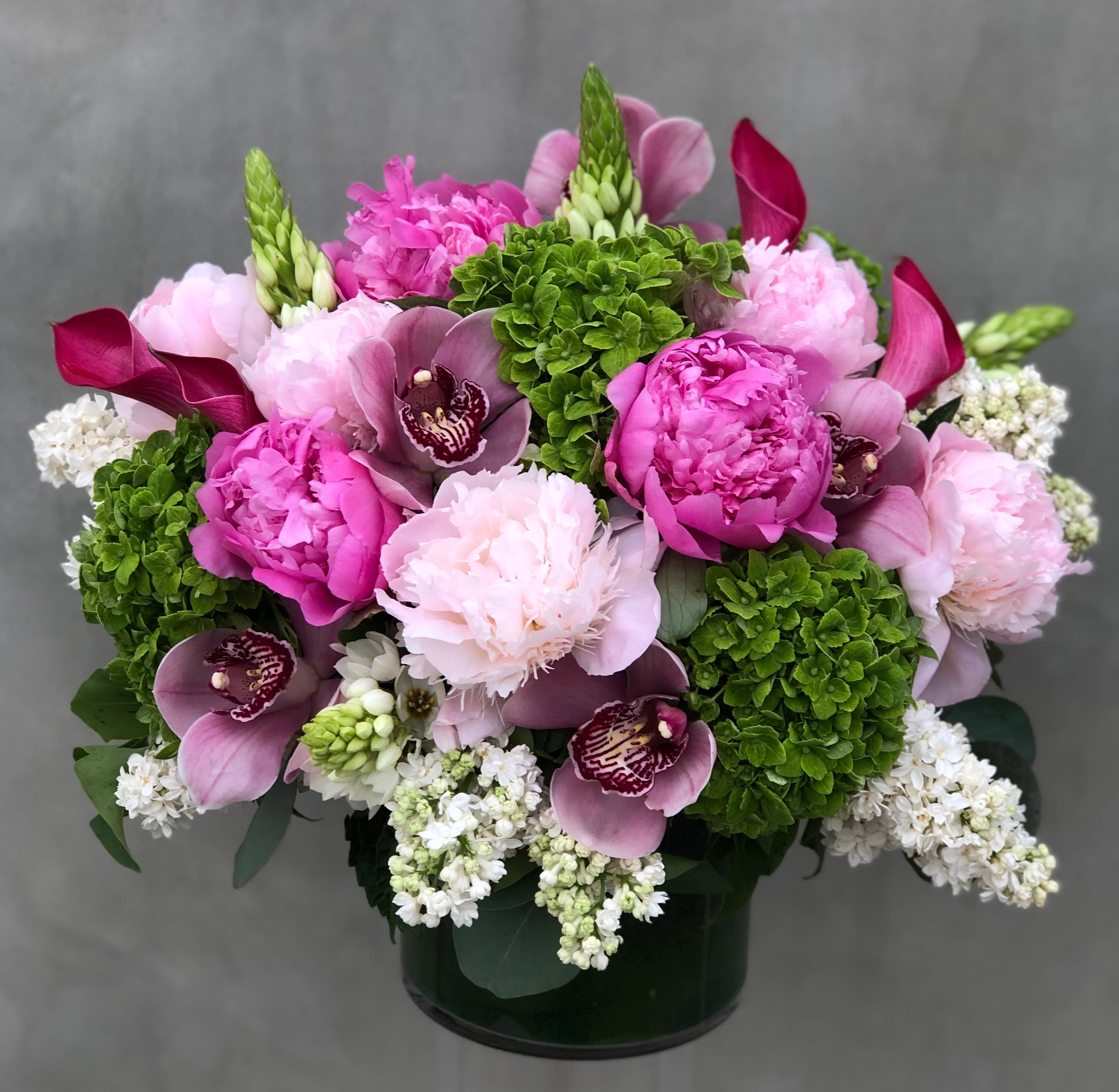 Lusciousness Peony Lusciousness Peony - Beautiful Floral arrangement filled with peonies hydrangeas calla lilies orchids and much more. (PREMIUM SHOWN ON IMAGE)