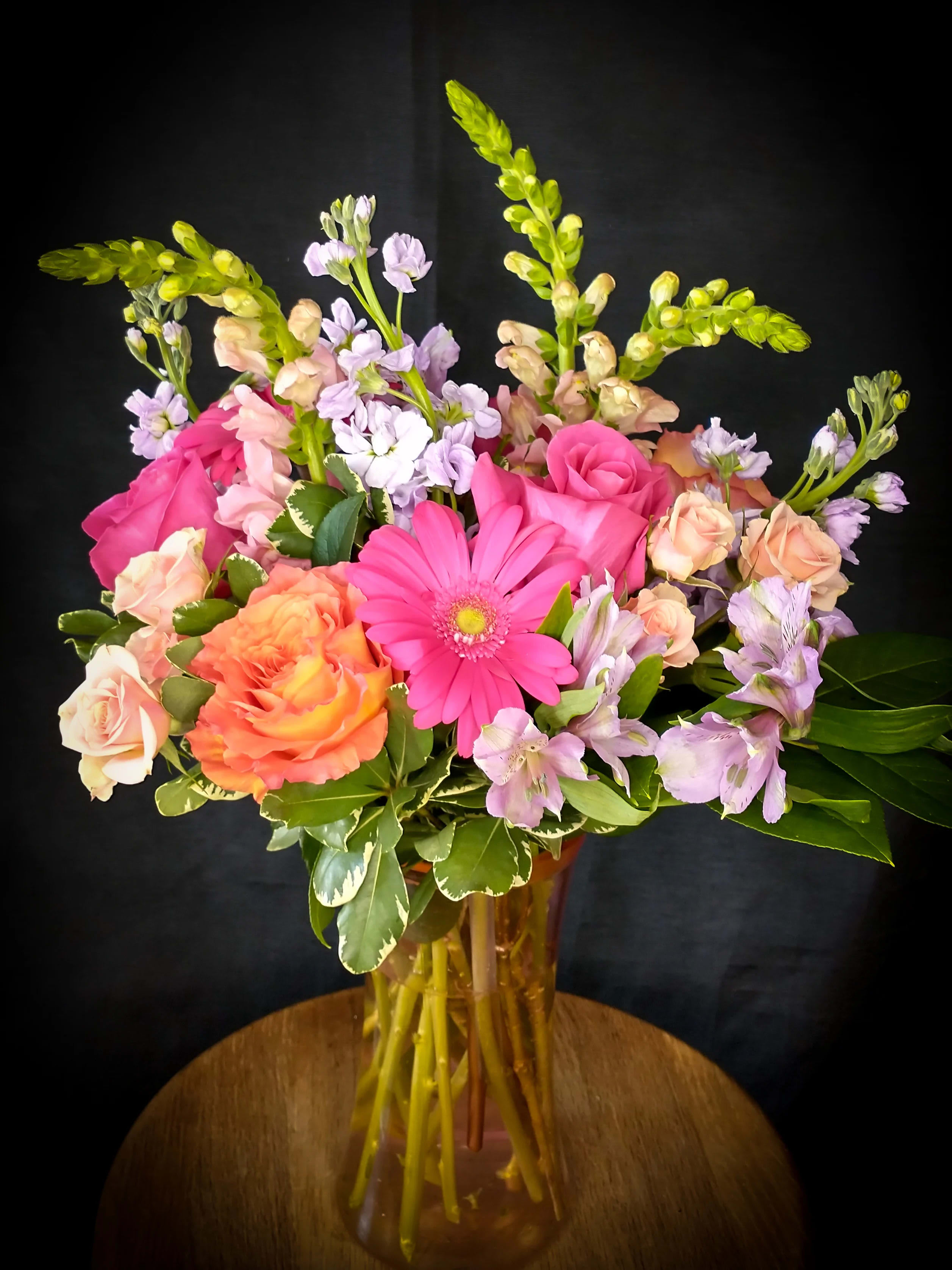Summer Love Summer Love - Sweet saturated colors bring forth memories of that long forgotten summer romance. Shades of pink and lavender comprise this upright arrangement.