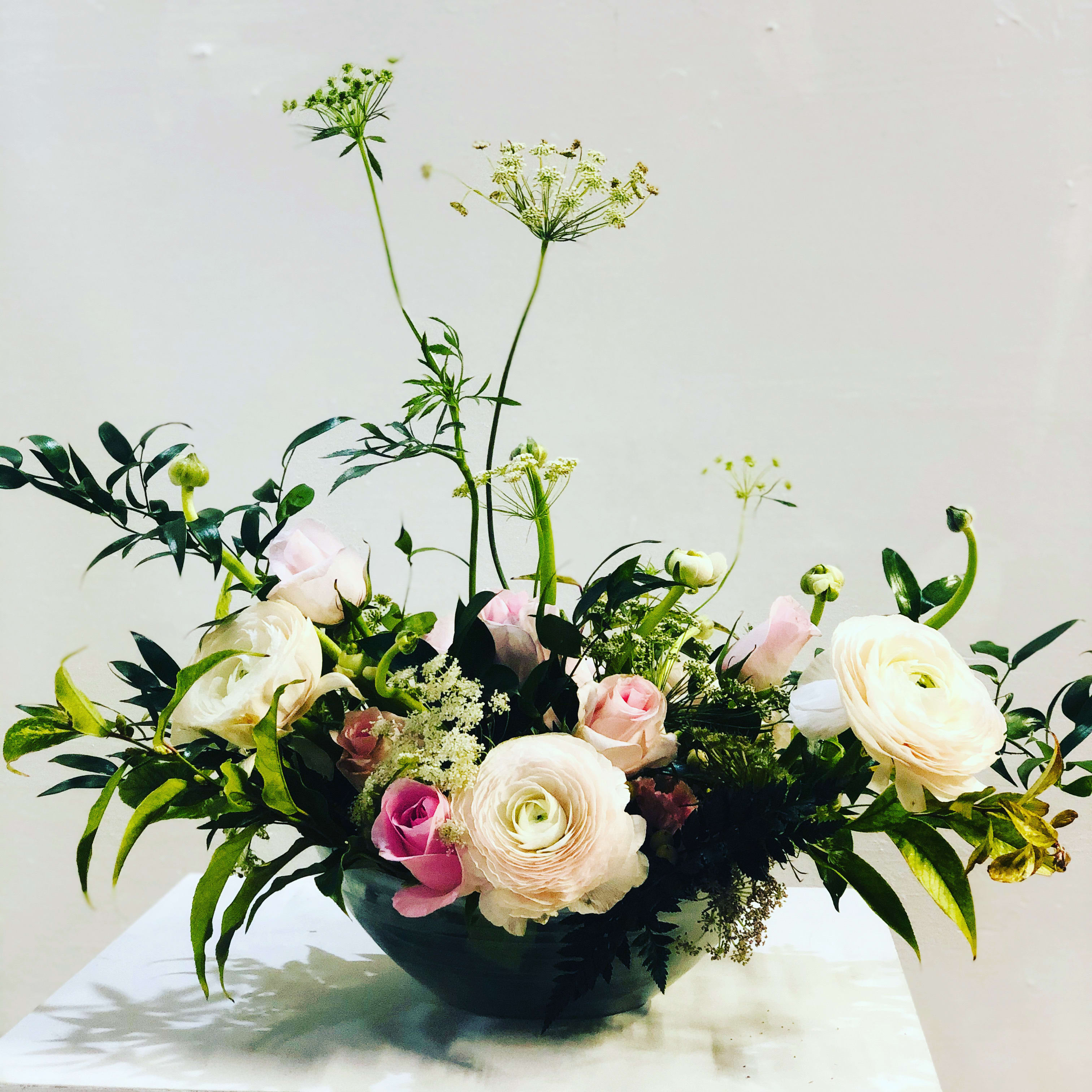 Designer’s Choice - **Please specify if you want a replica of the design as shown.*** Otherwise, the designer will use seasonal flowers tailored to the occasion, recipient’s personality and or taste. Please add as much information i.e. fav colors, flowers, allergies etc. We will do our best to design something unique. The designer container is a recycled &quot;boat&quot; like container. Please specify if you prefer a vase. 
