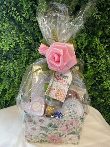 Happy Mothers Day Gift Box Happy Mothers Day Gift Box - A sweet assortment including gourmet snacks, small candle that says Happy Mothers Day and a Bath Bomb - all wrapped up with a ribbon rose bow and tag that says "Happy Mothers Day"