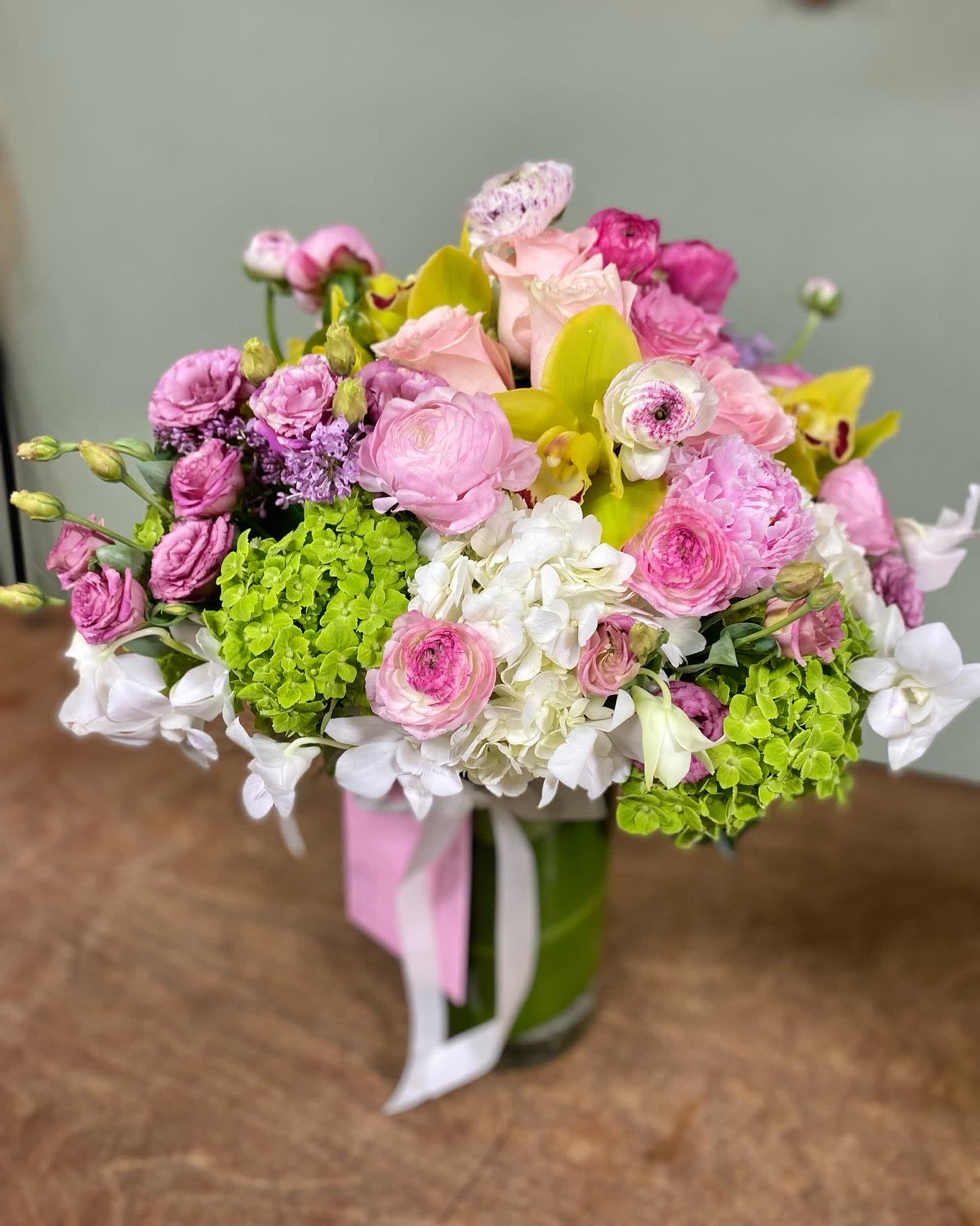 Stay Darling - This exquisite arrangement includes hydrangeas, ranunculus, lisianthus, cymbidium orchids, roses and peonies. This is a one of a kind arrangement and it is the perfect way to say happy birthday, thank you and show love on Mother's Day. 