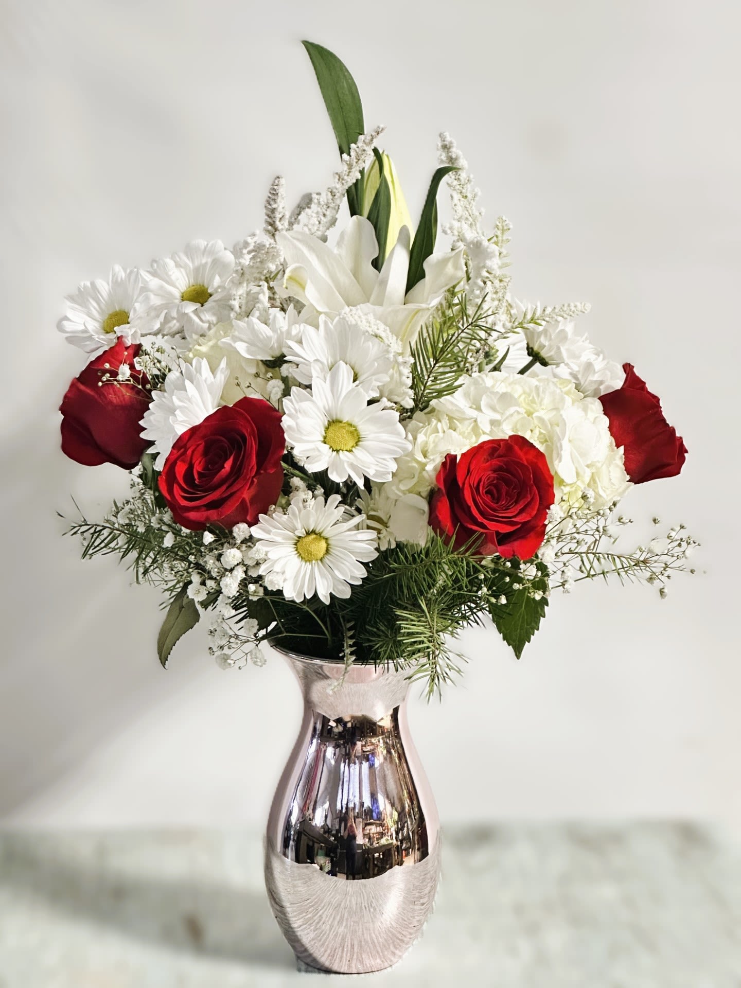 Love &amp; Romance #1 - Arrangement of fresh cut flowers designed in a metallic ceramic vase. 