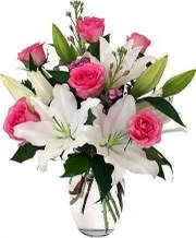 Always pink Always pink - A beautiful arrangement with pink rose and white lilies in a clear vase