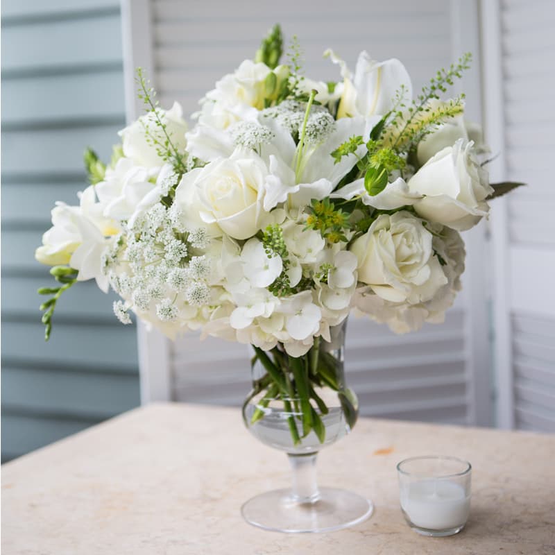 Elegant White Mix Elegant White Mix - Elegant mix of whites featuring roses, hydrangeas, and asiatic lilies.