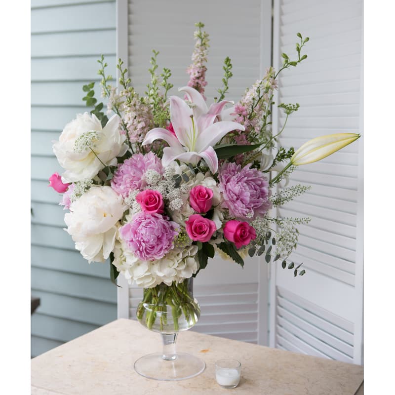Peonies, Hydrangeas, Roses, and Lilies Peonies, Hydrangeas, Roses, and Lilies - Extravagant design featuring pink and white peonies, hydrangeas, roses, and asiatic lilies. If peonies are not available, we will use lush garden roses.