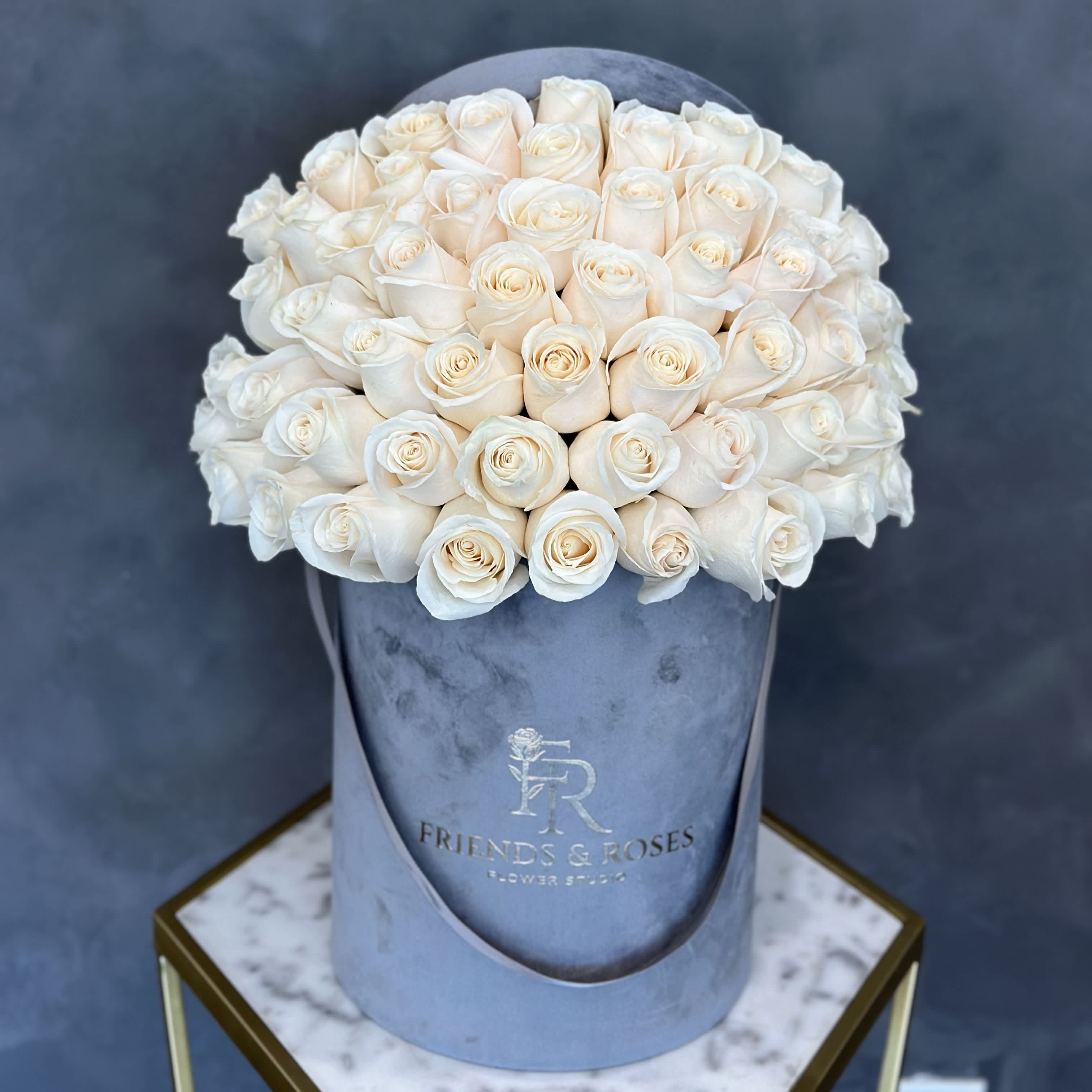 Skylar Skylar - Our signature gray box, filled with 50 fresh-cut white roses, is a sophisticated and beautiful present for any event.