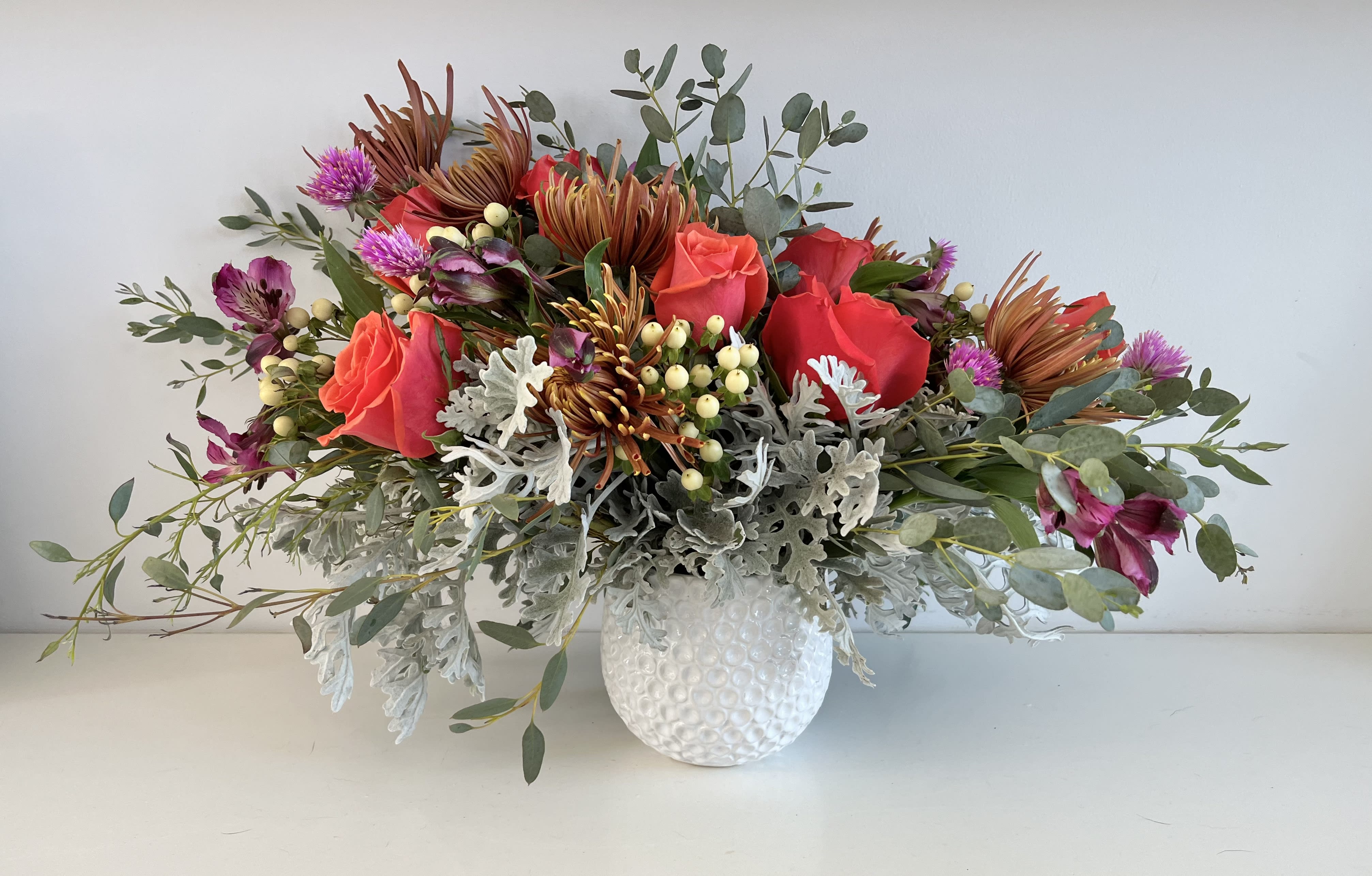 The Jewels The Jewels - Rich colors of in season flowers make up this wonderful design