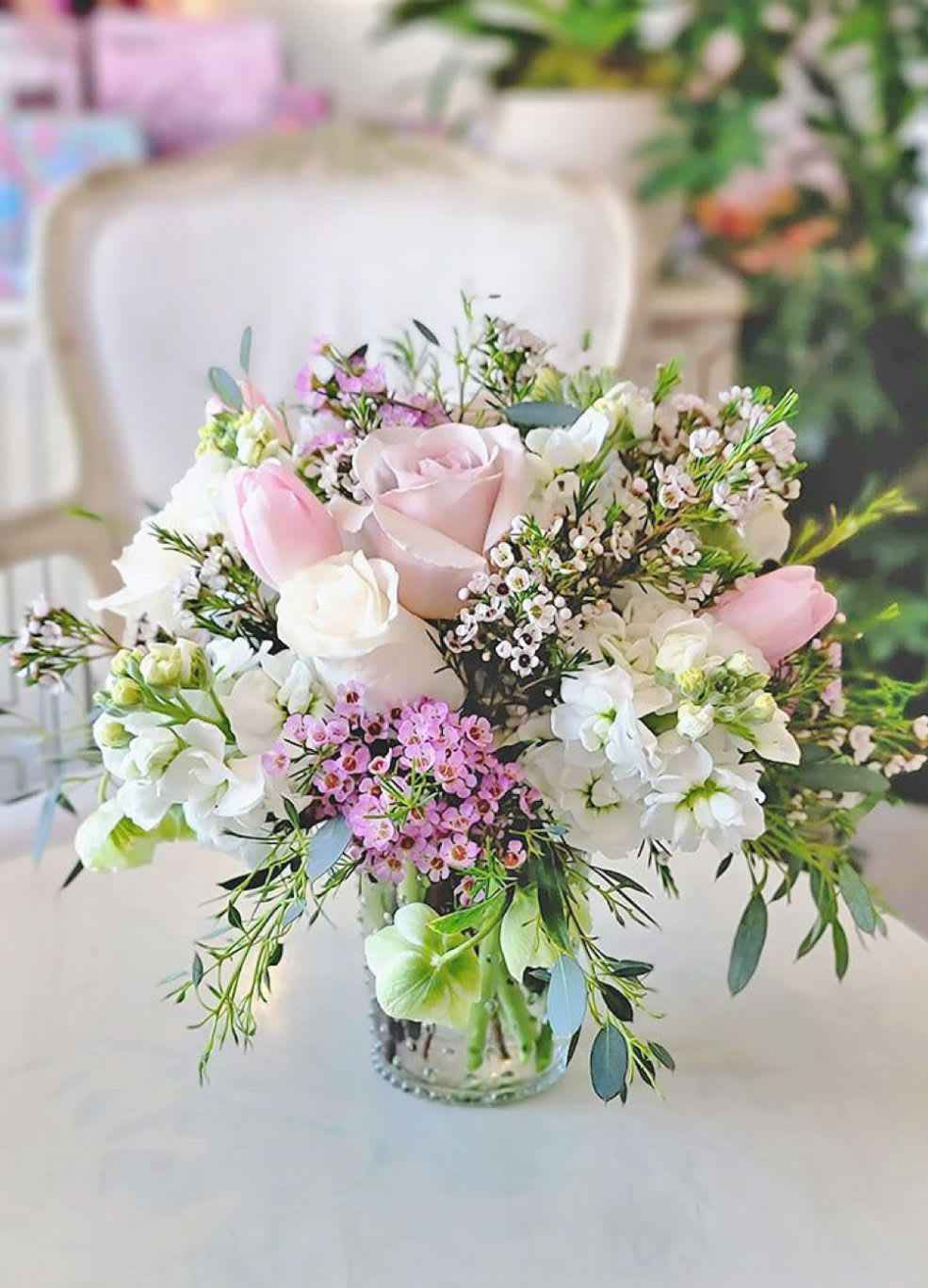 Sweet Spring Vase - Blush pinks and white flowers in a vase designed with greens and fillers. 