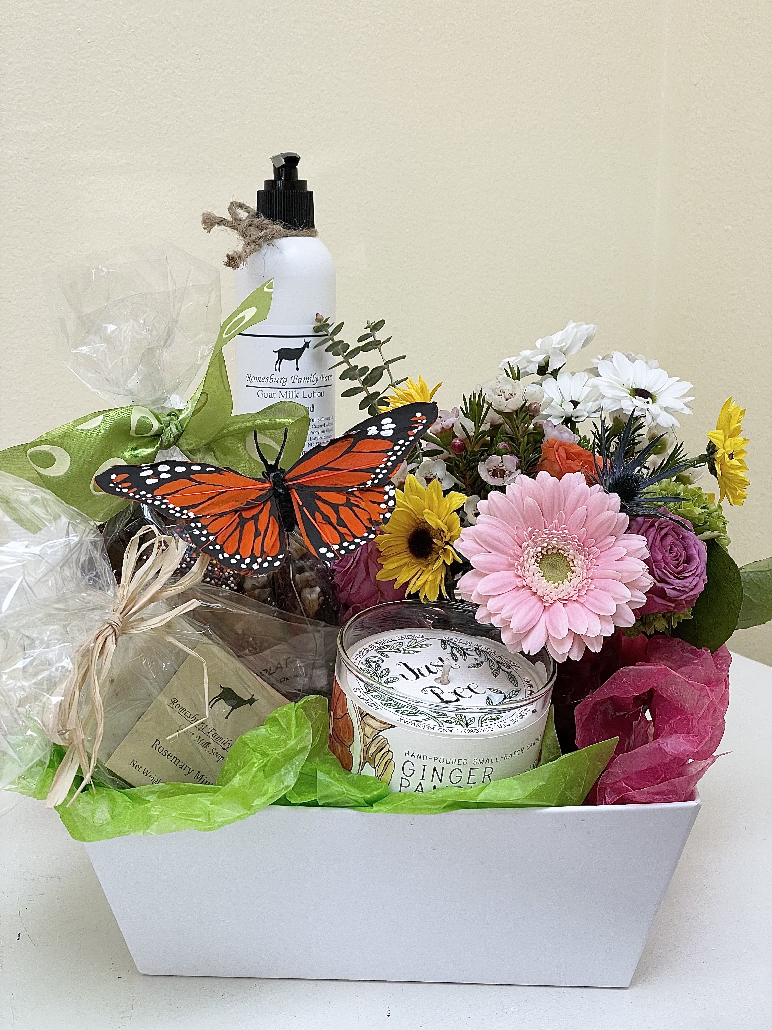 Spring Gift for Mom - A stylish, uplifting and useful gift, wrapped beautifully for presentation. We include an elegant flower arrangement, Romesburg Family Farm goats milk lotion and soap, locally made chocolate from Affaire Chocolat and a Just Bee candle ( beeswax ) decorated with a butterfly.