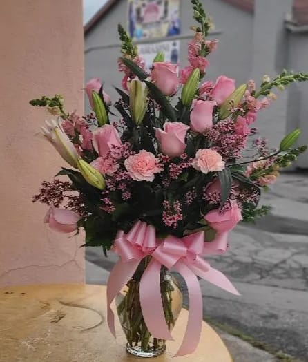 Blush roses &amp; blush carnations.  - This is a one sided arrangement, includes, roses, carnations, filler flowers, was flower &amp; snapdragons. 