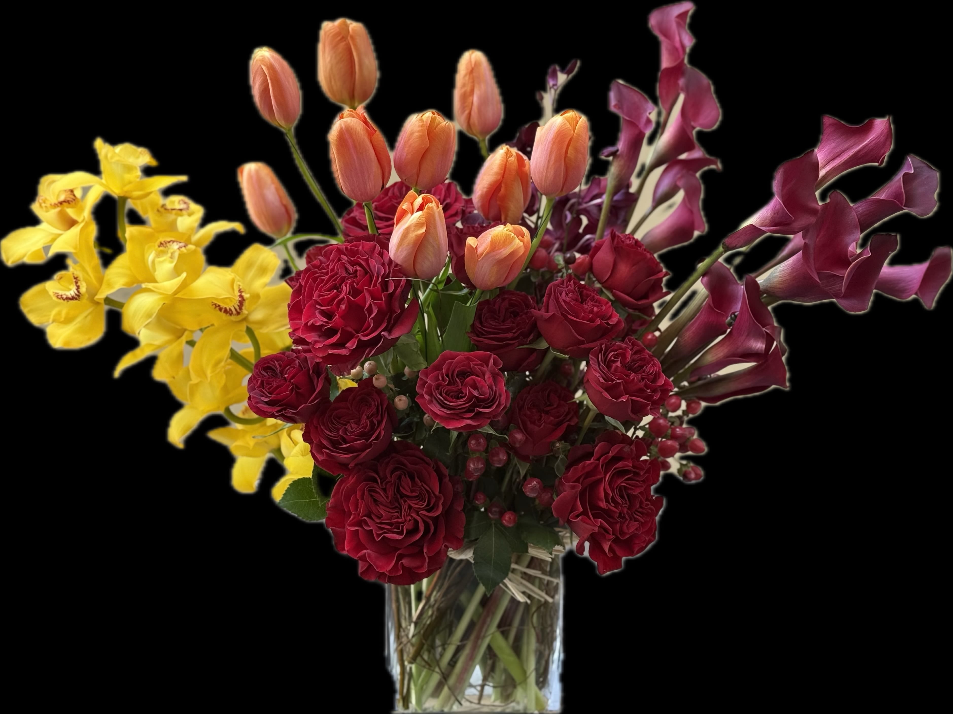 Queen of everything 2! - An amazing assortment of garden roses, vibrant French tulips, stunning cymbidium orchids from New Zealand, and striking red calla lilies in a chic low vase!