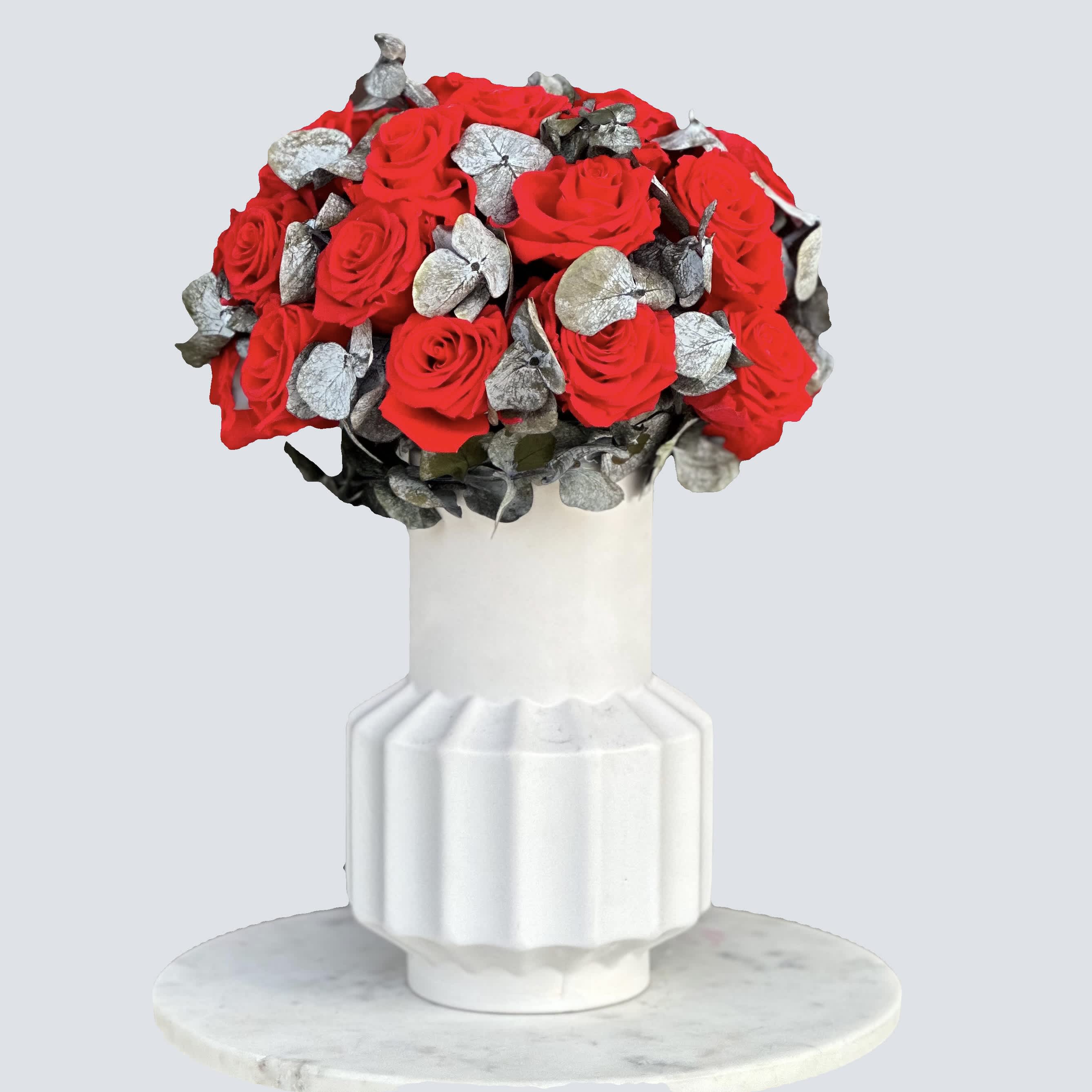 Preserved mix in a vase - Experience the luxury of mixed florals set in our charming Vase. This delicate arrangement showcases a symphony of mixed preserved flowers, including eucalyptus and roses. This is the perfect gift for your nearest and dearest that will remind them of you for 2 years.
