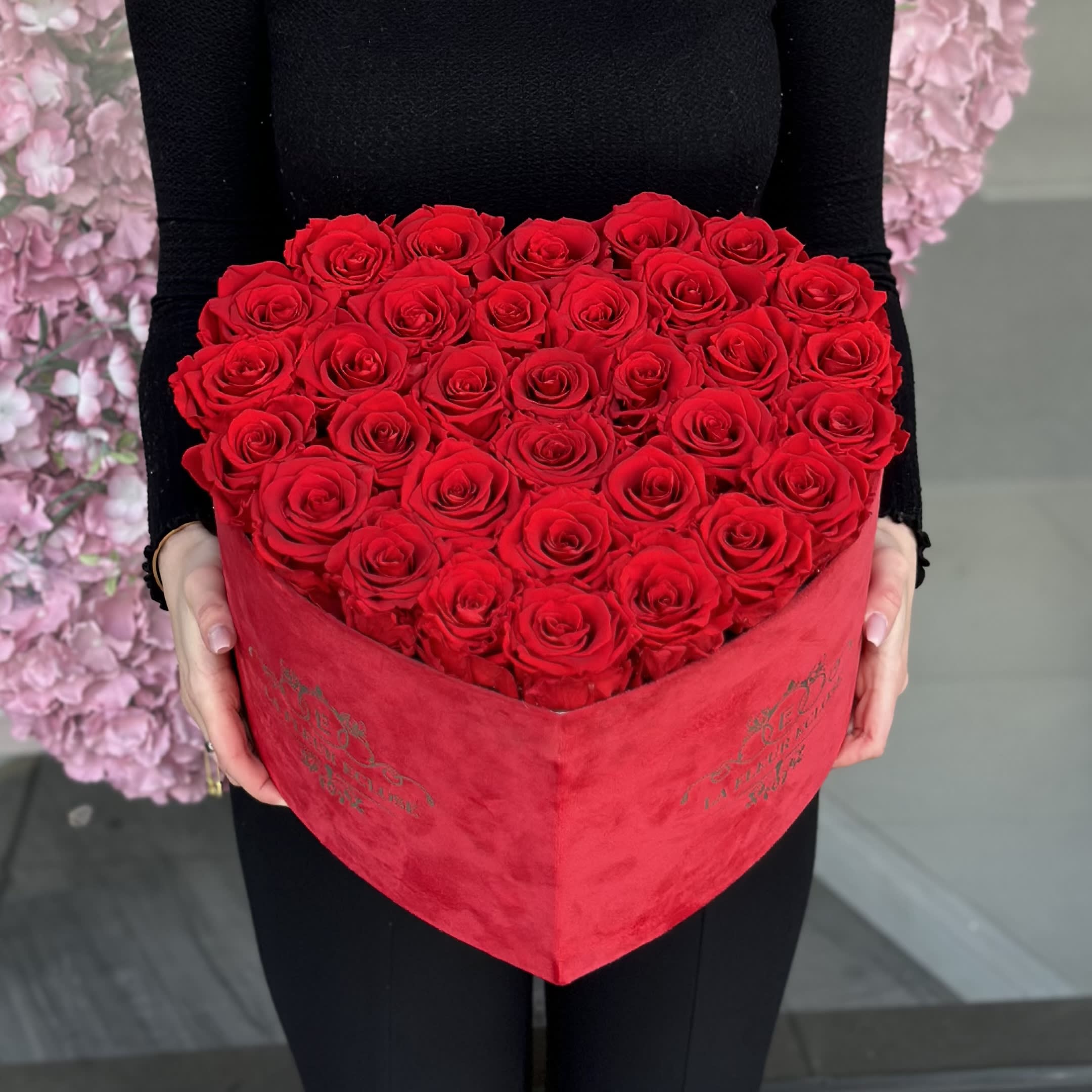Preserved roses in a heart velvet shaped Box V - Preserved red roses in a red velvet Heart Shaped Box .Lasts one year V