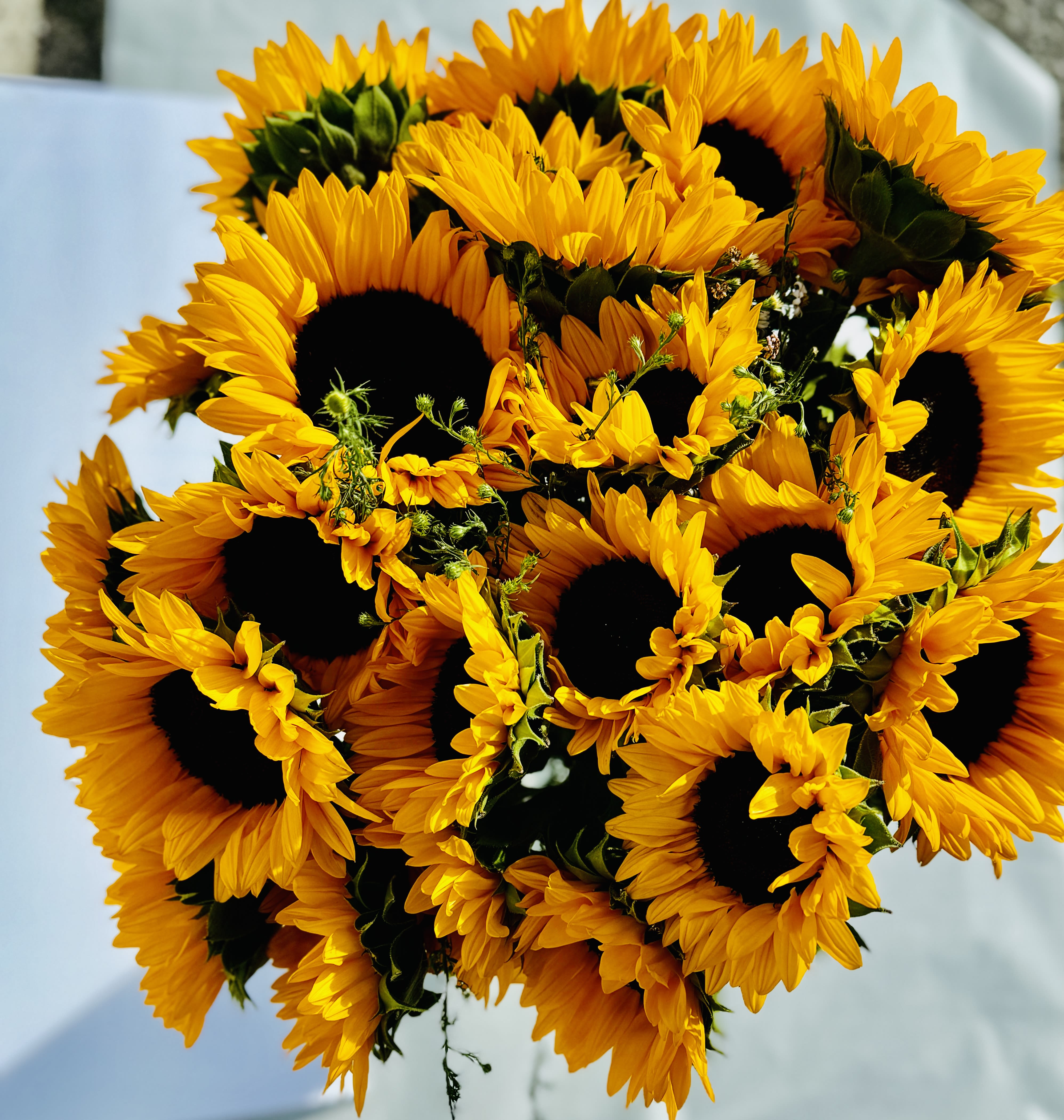  Sunflower Bouquet - This is a floral arrangement with premium sunflowers and other fillers .