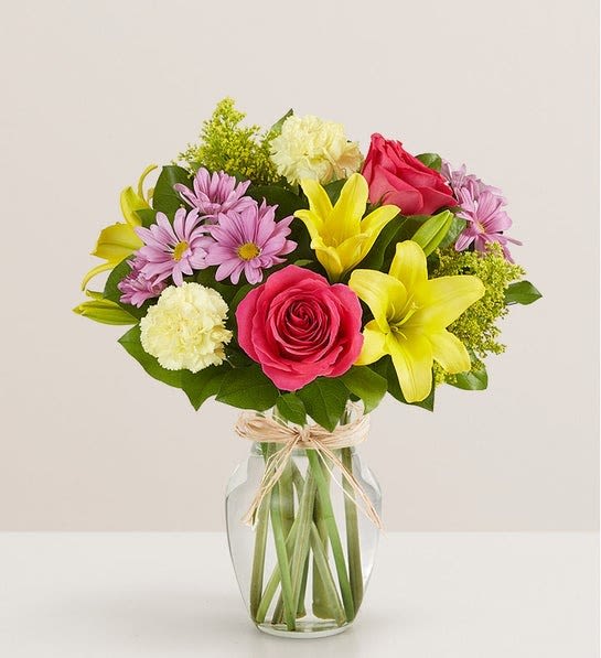Fields of Europe for Spring - Our best-selling spring bouquet is inspired by the traditional, hand-tied arrangements found in flower markets throughout Europe. Gathered with a mix of vibrant blooms inside a classic glass vase, it brings a cheerful taste of old-world charm to the people you care about. 