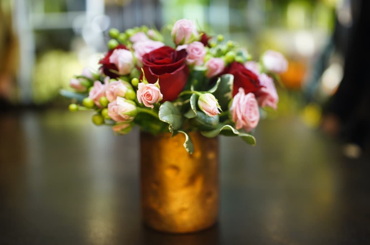 SOFT AND SWEET SOFT AND SWEET - pittosporum, hypericum, red roses and light pink spray roses.