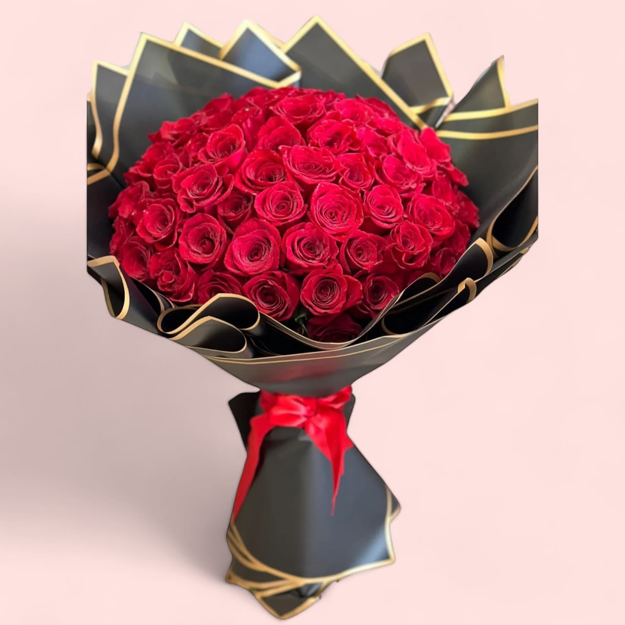 Red Roses 50ct Bouquet Red Roses 50ct Bouquet - features a stunning collection of 100 vibrant red blooms, carefully selected to create a dramatic and captivating arrangement. The rich, deep red roses or other red flowers in the bouquet symbolize love, passion, and admiration, making it an ideal gift for a romantic occasion, anniversary, or celebration of love. The lush, full display of flowers offers a sense of elegance and luxury, while the sheer number of blooms adds an impressive, opulent touch. This bouquet is a timeless representation of deep emotion and affection, perfect for making a bold, heartfelt statement.