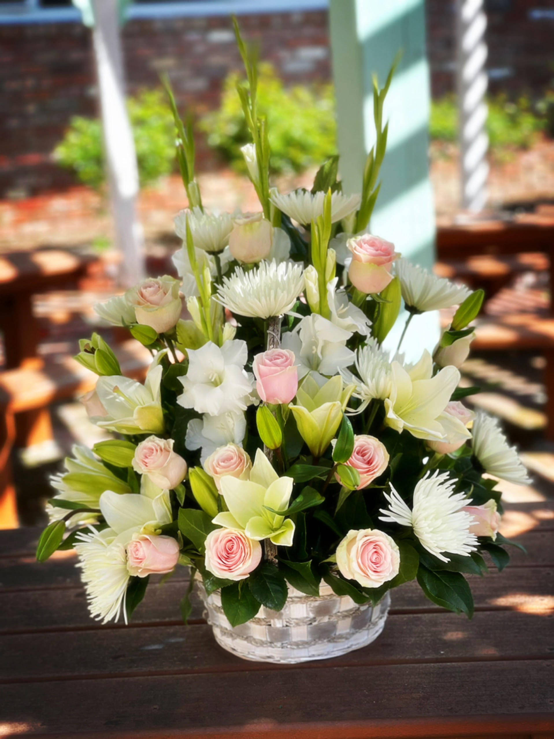 With Love Basket (Pink and White) With Love Basket (Pink and White) - - 5 Stems White Gladioulous (or Snapdragons) - 3 Stem White Asiantic Lilies - 12 Stems Pink Roses - 8 Stems White Spider mums - Greenery - 8 Inches Basket