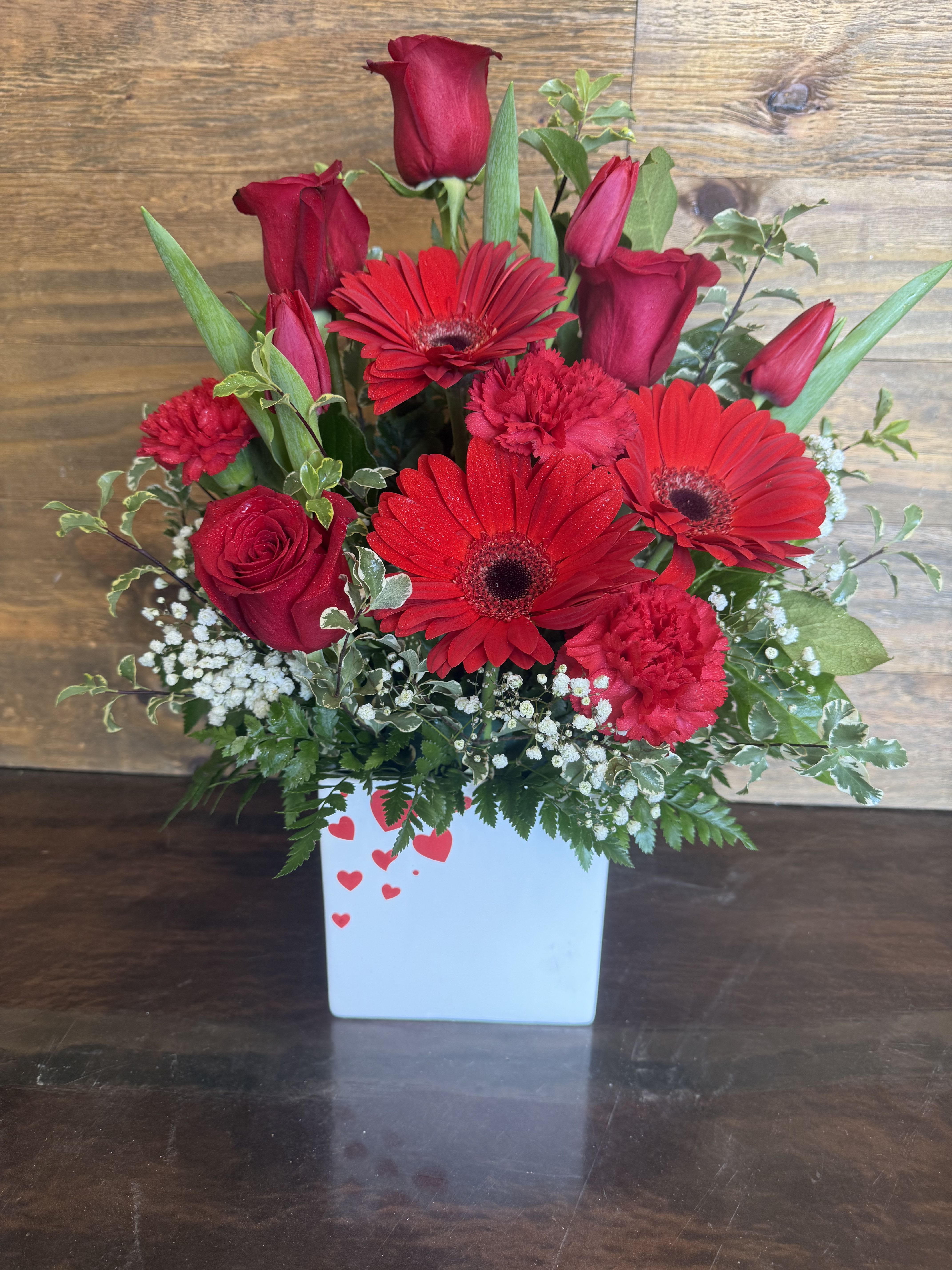 Hearts Delight  - Beautiful arrangement of red Roses, Gerbera daisies, Tulips and carnations! 