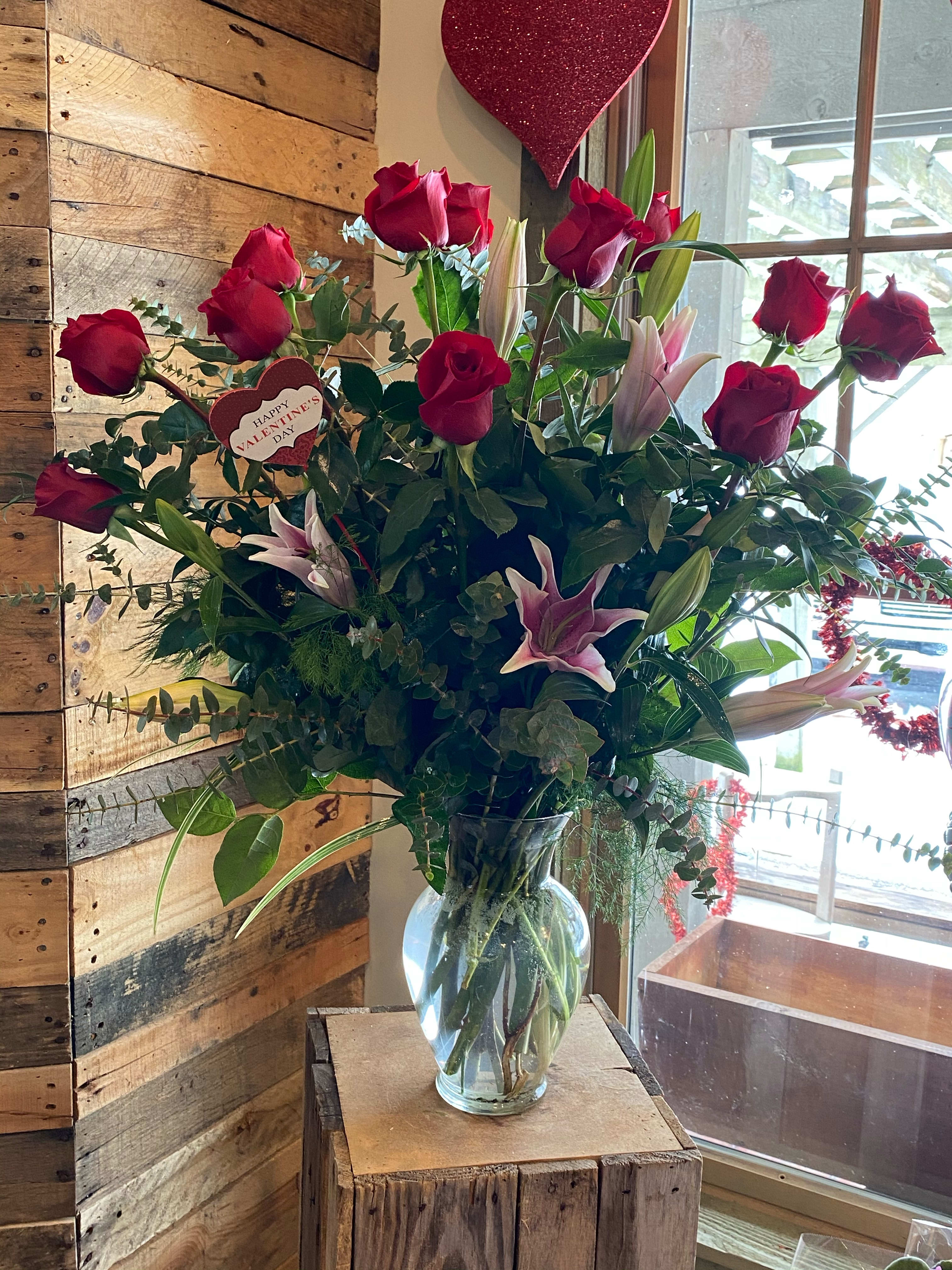 Stargazer Wonder  - About 27 inches tall. This arrangement includes star gazer lilies, hot pink roses, and eucalyptus. Lily Substitutions may be applied - Pink, Stargazer, White 