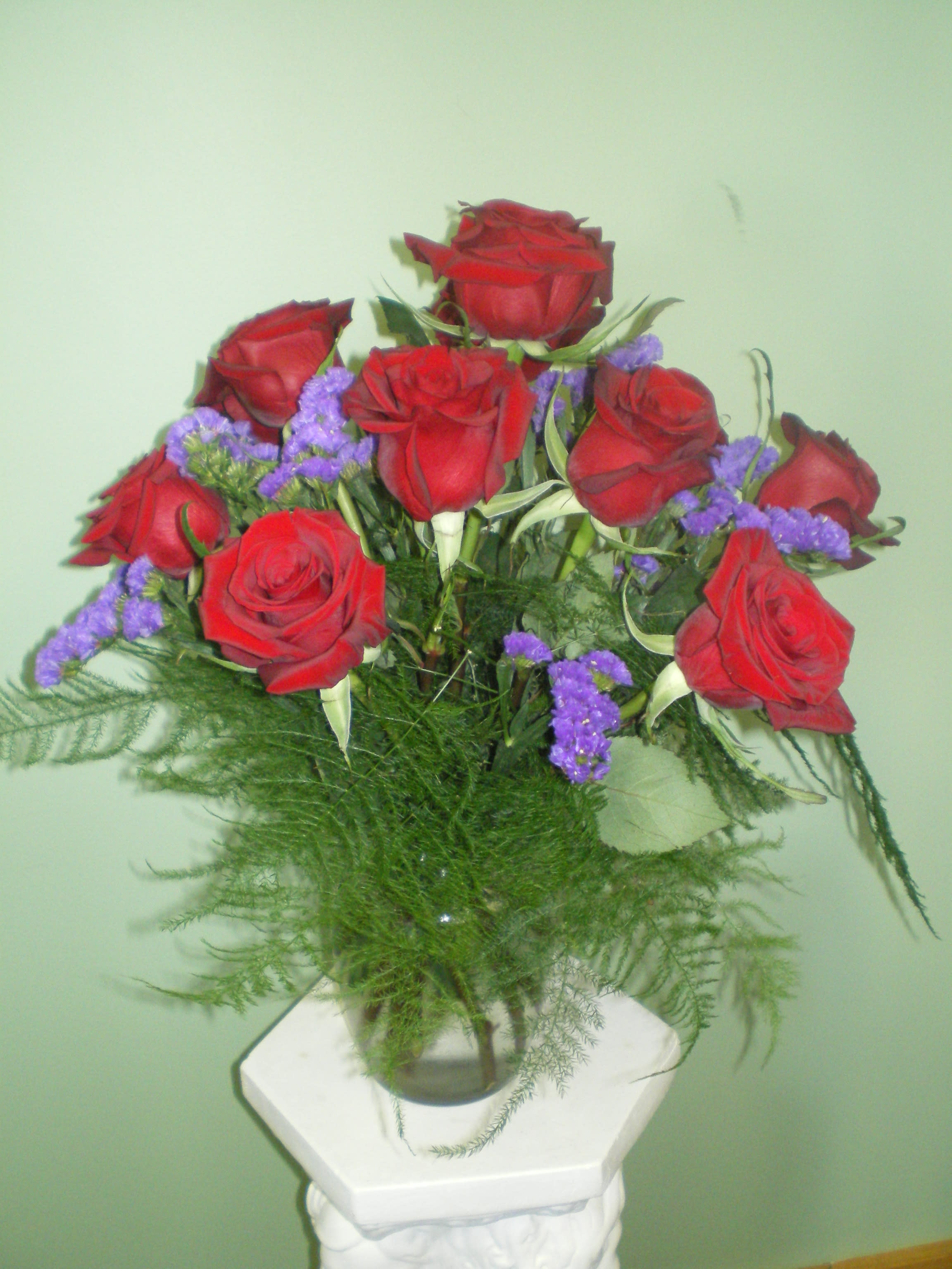 clasic dozen roses - One dozen red roses arranged in a garden vase with your choice of available accent flowers and greenery. If you have another color preference please note that in the special instructions. Lavender, dark pink, yellow and white also available.