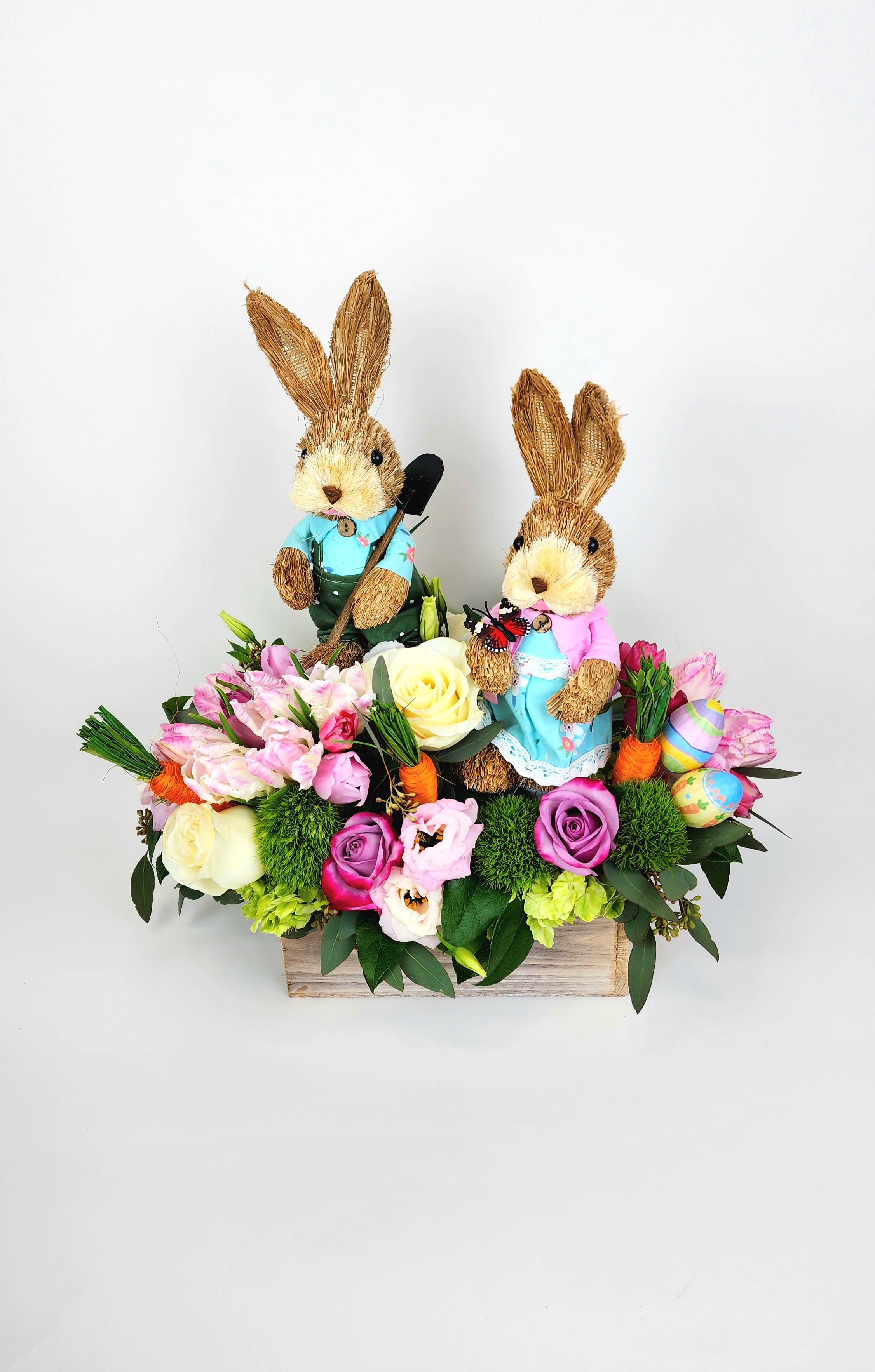Spring Farmers Bunny Love - wood square vase with tulips, roses, hydrangeas, and fillers with two bunnies and Easter props.