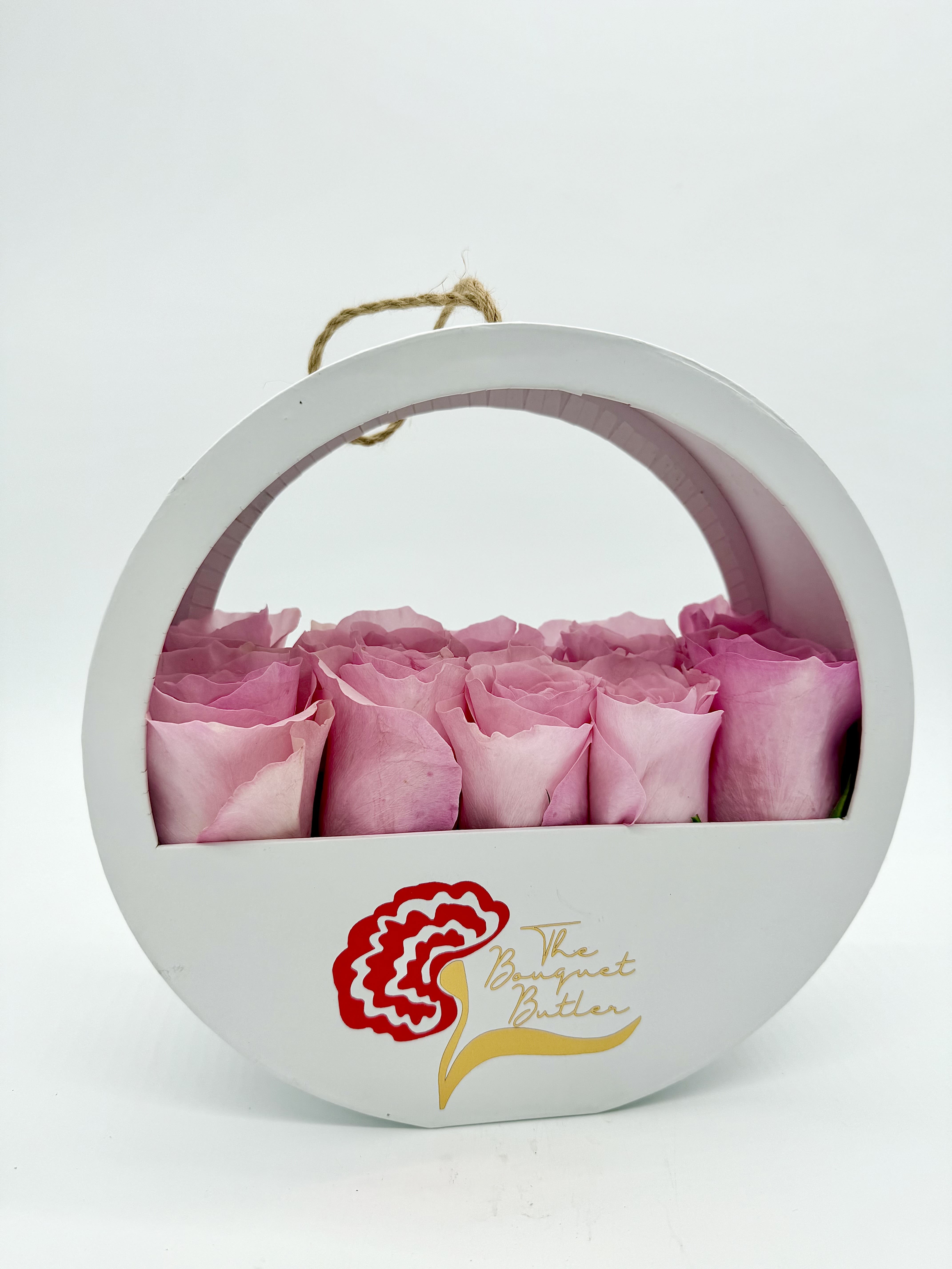 Custom Rose Bloom Box - Roses - A modern arrangement of premium roses in the color of your choice, styled in our white round hanging box. Sleek, simple, and full of meaning—this striking design is perfect for making Mom feel truly seen and celebrated.