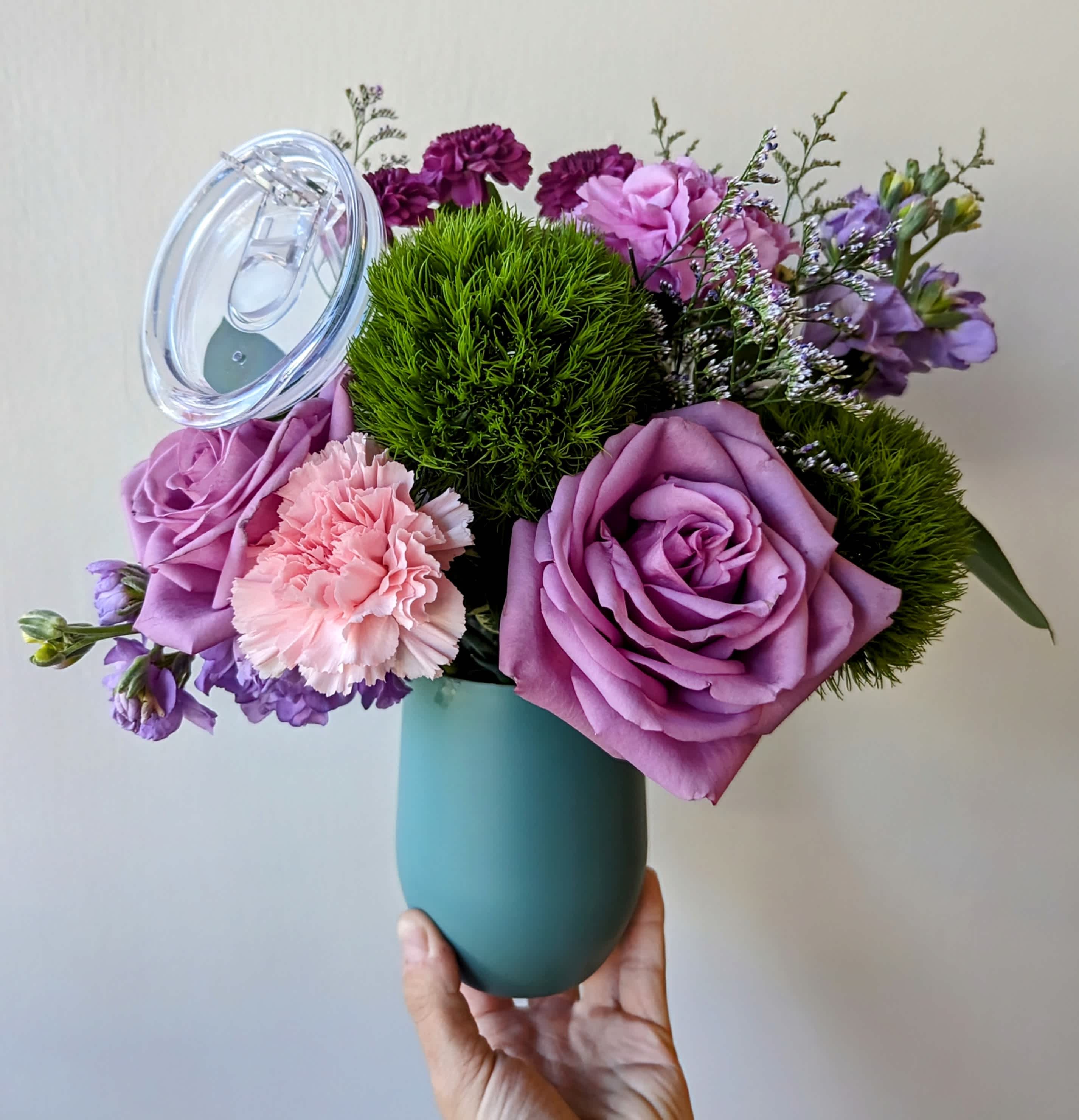 Rosé and Roses Arrangement - A beautiful selection of flowers arranged in a reusable insulated wine tumbler. Tumbler colors and florals may vary as each arrangement is made fresh daily.