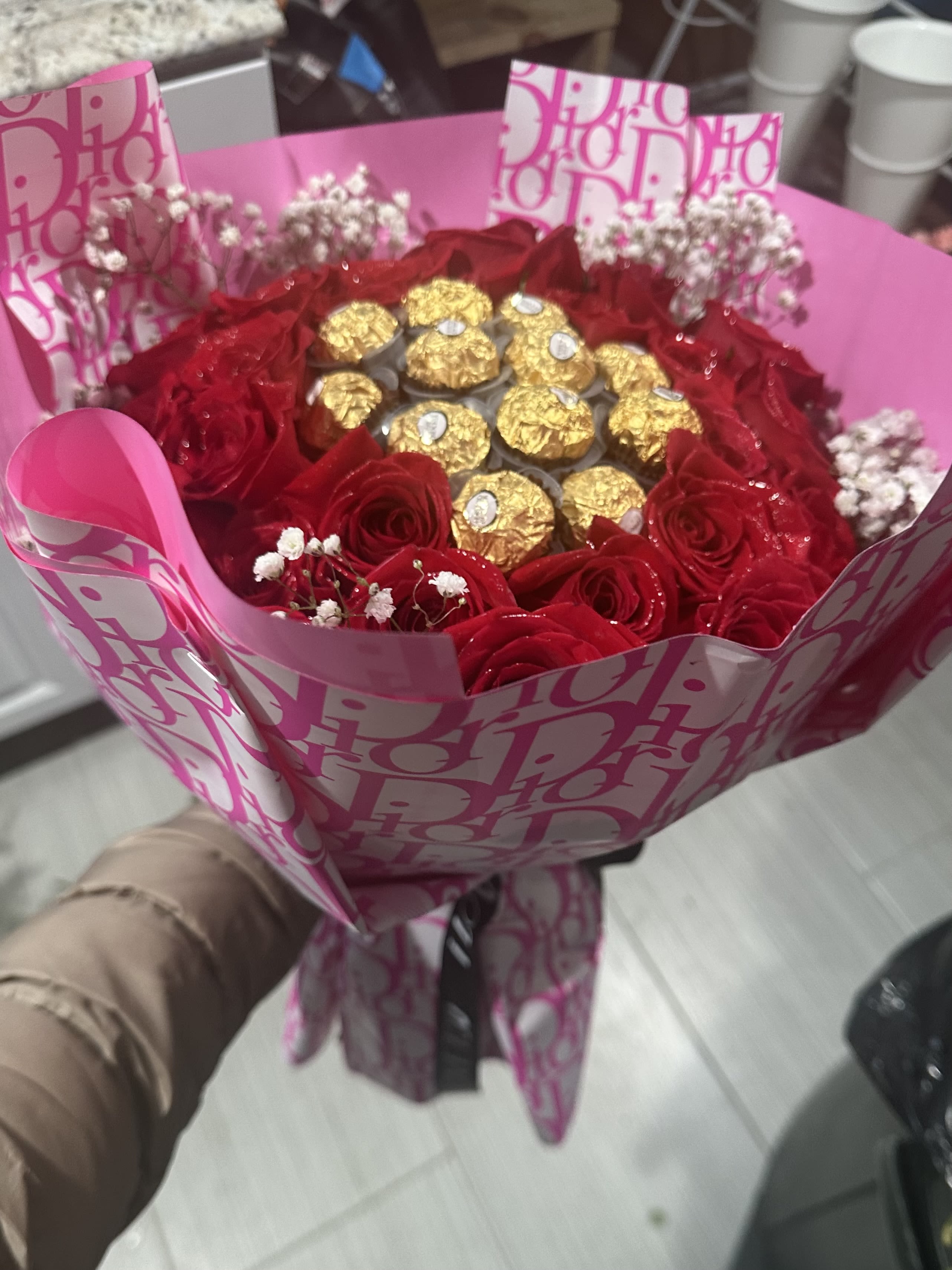 Red and Sweet Red and Sweet - This red roses and chocolate bouquet wrapped in Dior designer paper perfect gift birthday or any other especial ocasión Bring: 24 red roses and 12 pcs chocolate
