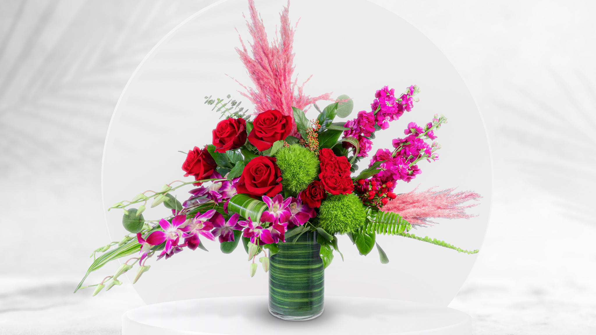 I Love You  - This Unique design includes premium red roses, red spray roses,  variegated purple dendrobium orchids, hot pink stock, pink pampas grass, dianthus green trick, eucalyptus, and tropical foliage. 