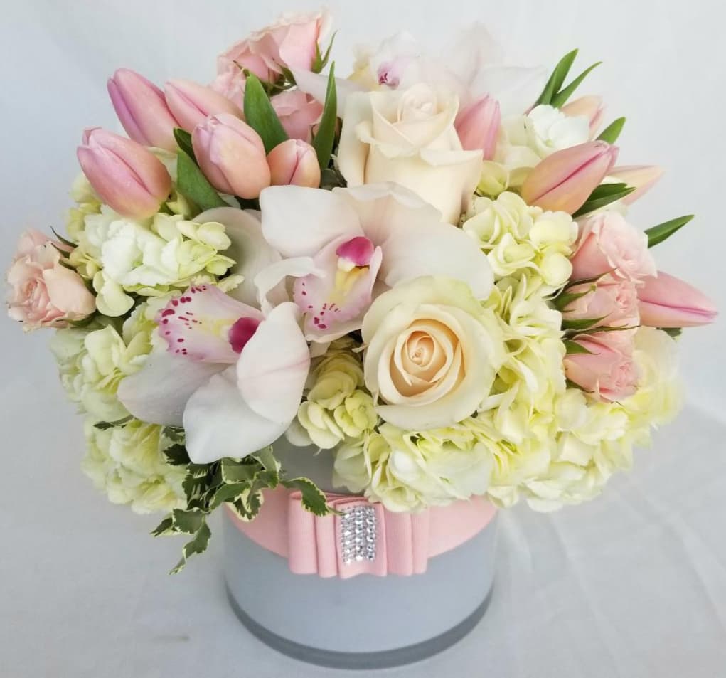 Baby girl Pink Dream Palette - Immerse yourself in the allure of &quot;A Pink Dream Palette,&quot; a stunning floral arrangement exclusively from Dave's Flowers, your local Los Angeles florist. This soft and gorgeous ensemble features fresh hydrangeas, pink tulips, cymbidium orchids, roses, and lisianthus flowers, creating a dreamy symphony of beauty.  At Dave's Flowers, we specialize in crafting floral masterpieces that evoke emotions and turn dreams into reality. &quot;A Pink Dream Palette&quot; is meticulously designed to offer a soft and stunning arrangement that adds a touch of elegance to any setting.  Explore the floral artistry of Dave's Flowers and order now to experience the perfect blend of hydrangeas, tulips, cymbidium orchids, roses, and lisianthus. Perfect for any occasion, this arrangement adds a touch of sophistication and freshness to your special moments. Elevate your surroundings with the exquisite beauty of &quot;A Pink Dream Palette&quot; from Dave's Flowers. We offer convenient Flower Delivery in Los Angeles to ensure your gift arrives fresh and ready to spread joy.