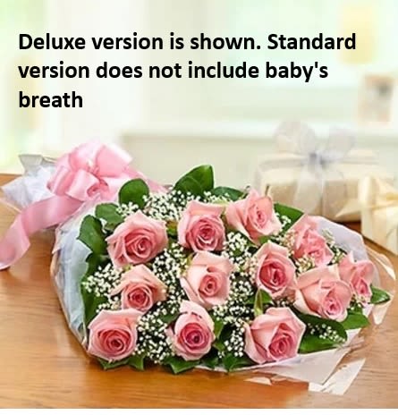 Pink Rose Bouquet - One dozen long stem pink roses wrapped presentation style. Ready for you to arrange in your own vase. Deluxe version is shown. Standard version doses not include baby's breath. Select deluxe version to include baby's breath