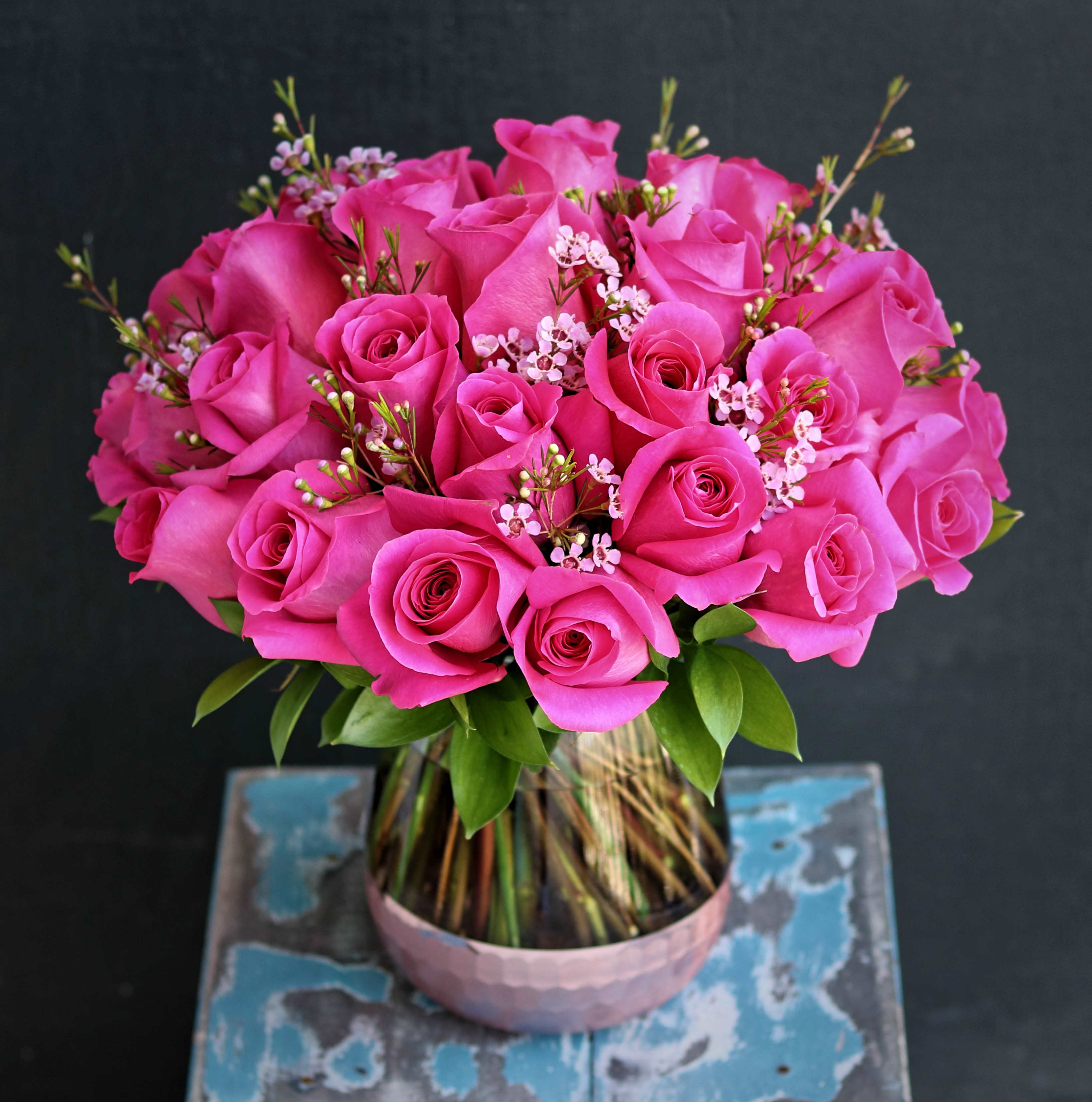 hot pink roses hot pink roses - This arrangement include 25-30 roses in glass vase with partial textured foil finish. Handwritten card is included. Send the most beautiful flowers for that special someone. Next day delivery available to Tequesta, Jupiter, Palm Beach Gardens and Palm Beach.