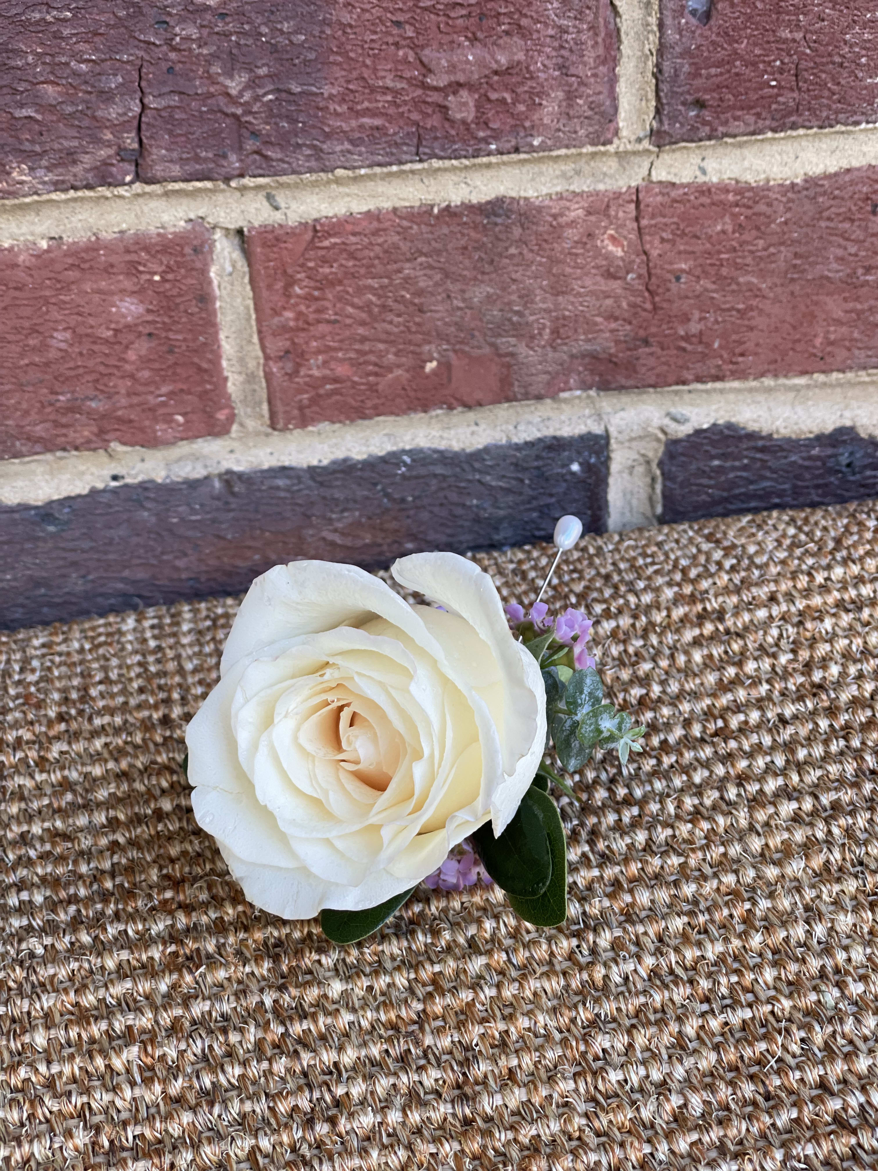 White Rose Boutonniere - A white rose boutonniere for him. Perfect for prom and weddings.  Note: Color of rose can be changed including the wax flower color
