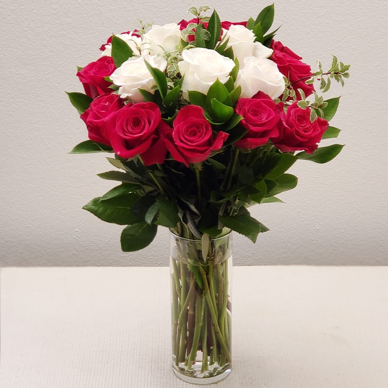 From Me To You Bouquet - There’s something about the perfect mix of white and red blooms that makes our hearts skip a beat.   This stunning arrangement features elegant roses, making it the ideal choice for celebrating love, whether it's an anniversary, birthday, Valentine's Day, or any special moments.  Approximate Size: 20&quot; H x 12&quot; W. Order now to send a gorgeous expression of love!