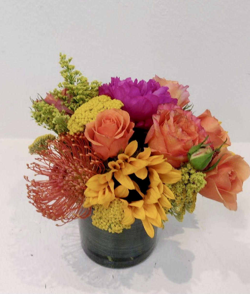 Tangerine Dreams - A splash of colorful flowers to celebrate someone special. 