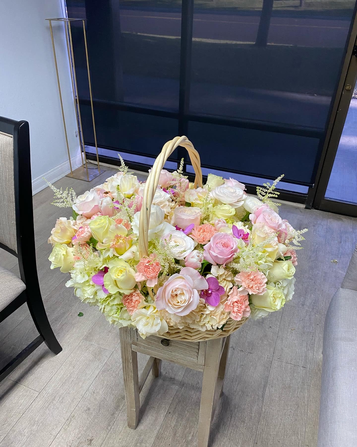Basket with garden roses and orchids  - Big basket with garden roses, orchids, roses, tulips, hydrangeas and other flowers.