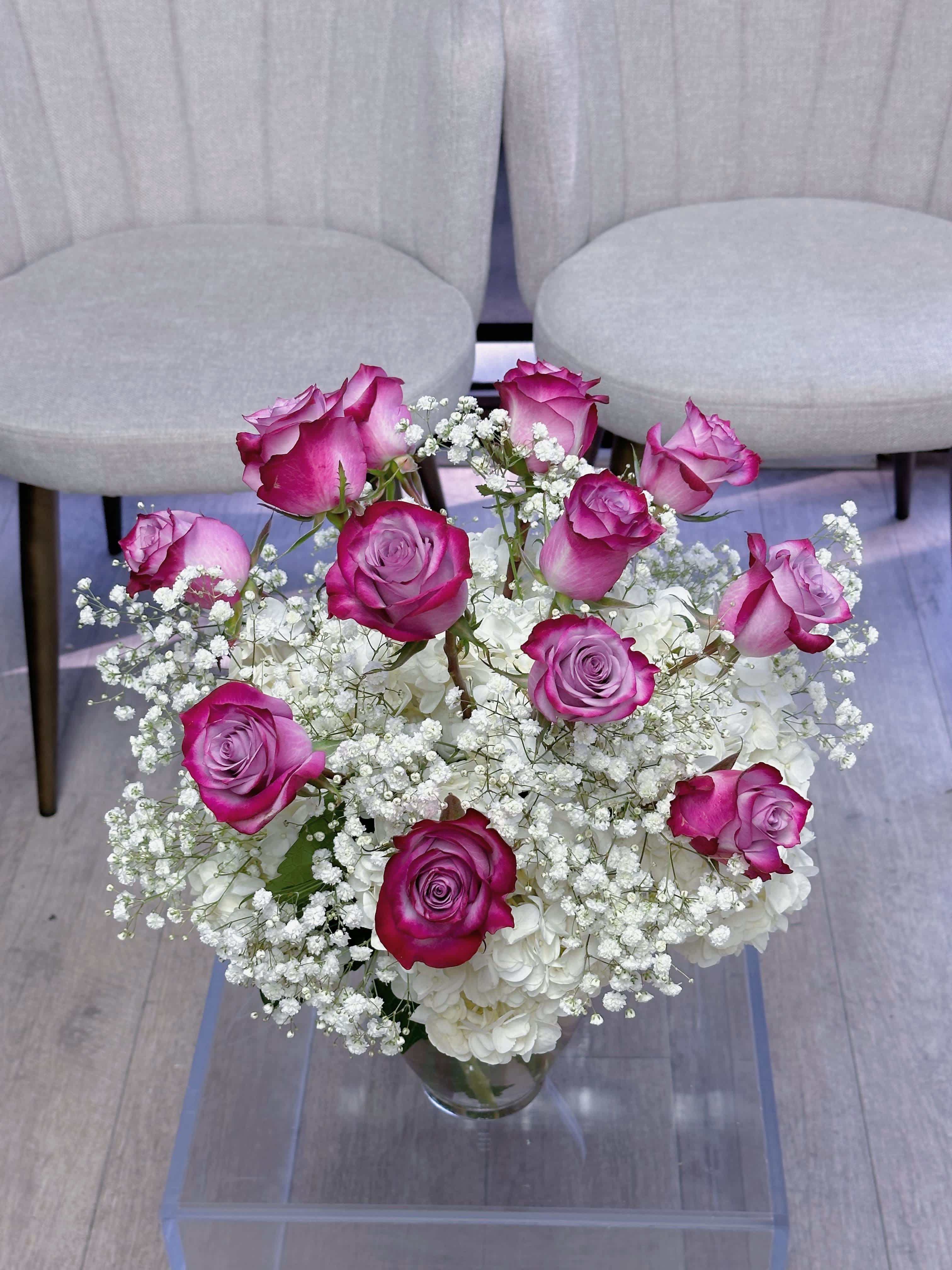 One dozen purple roses in a vase  - One dozen purple roses in a vase, accompanied with white hydrangeas and gypsophila flowers 