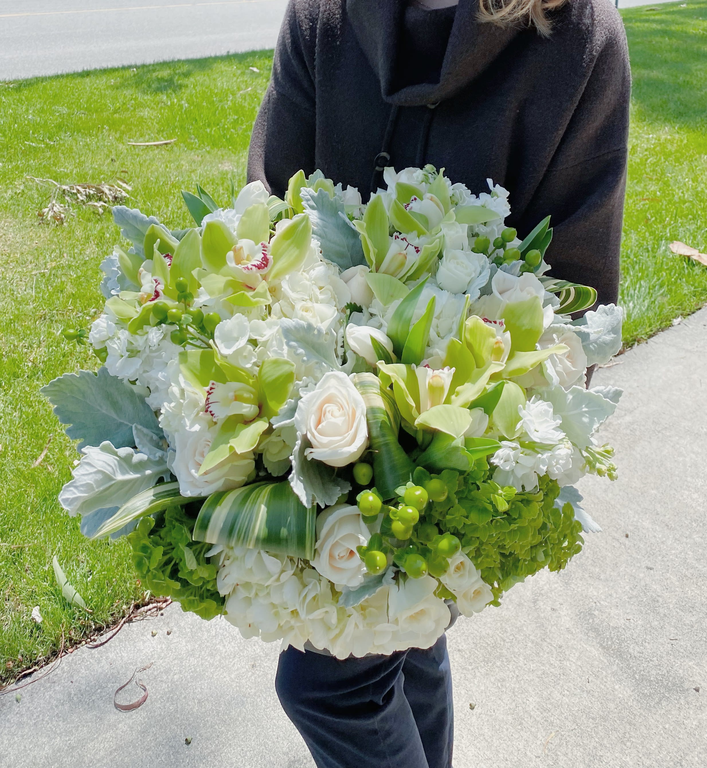 White wings  - Arrangement in a vase with white and green flowers and greenery. 