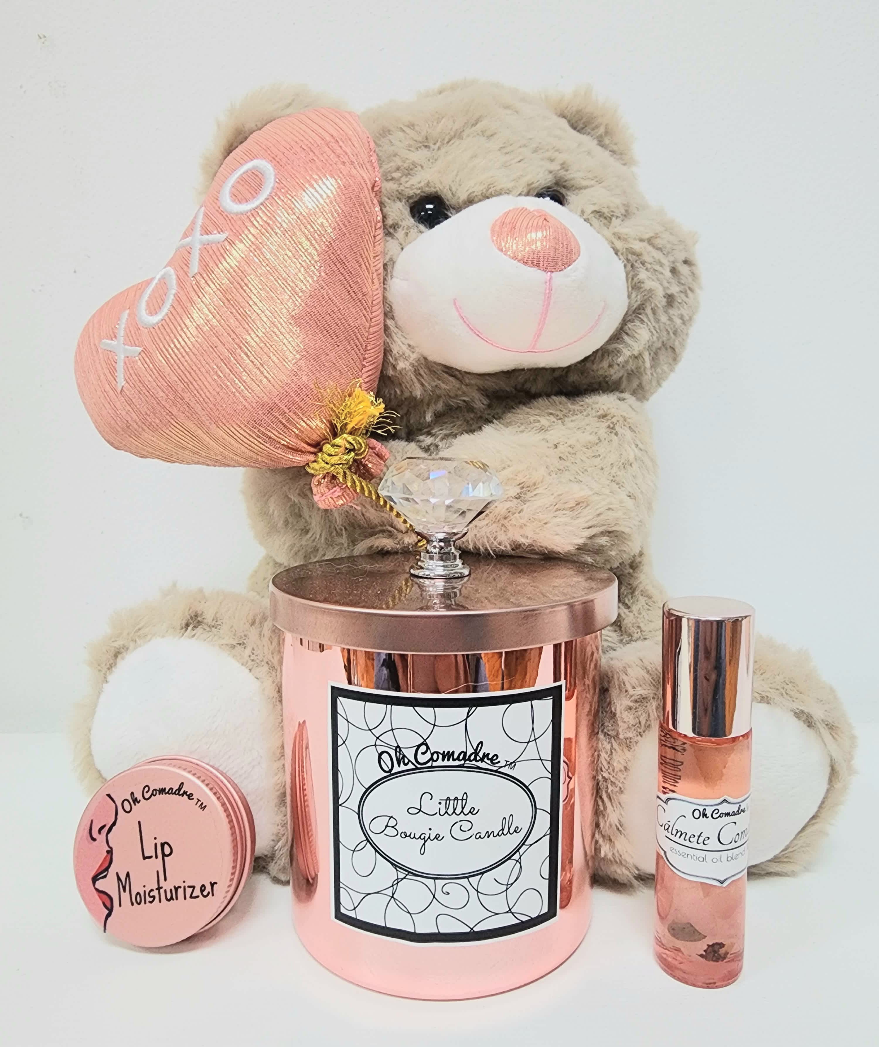 Mom's Candle Gift Set - Comes with a 10oz candle that is our shops favorite scent. It is accompanied with a lip moisturizer infused with organic almond oil and shea butter, an essential oils roll on that helps relax and calm the senses, plus a jewelry box, a clear gift bag(reusable) and chocolates. It all smells so good, she will love it!