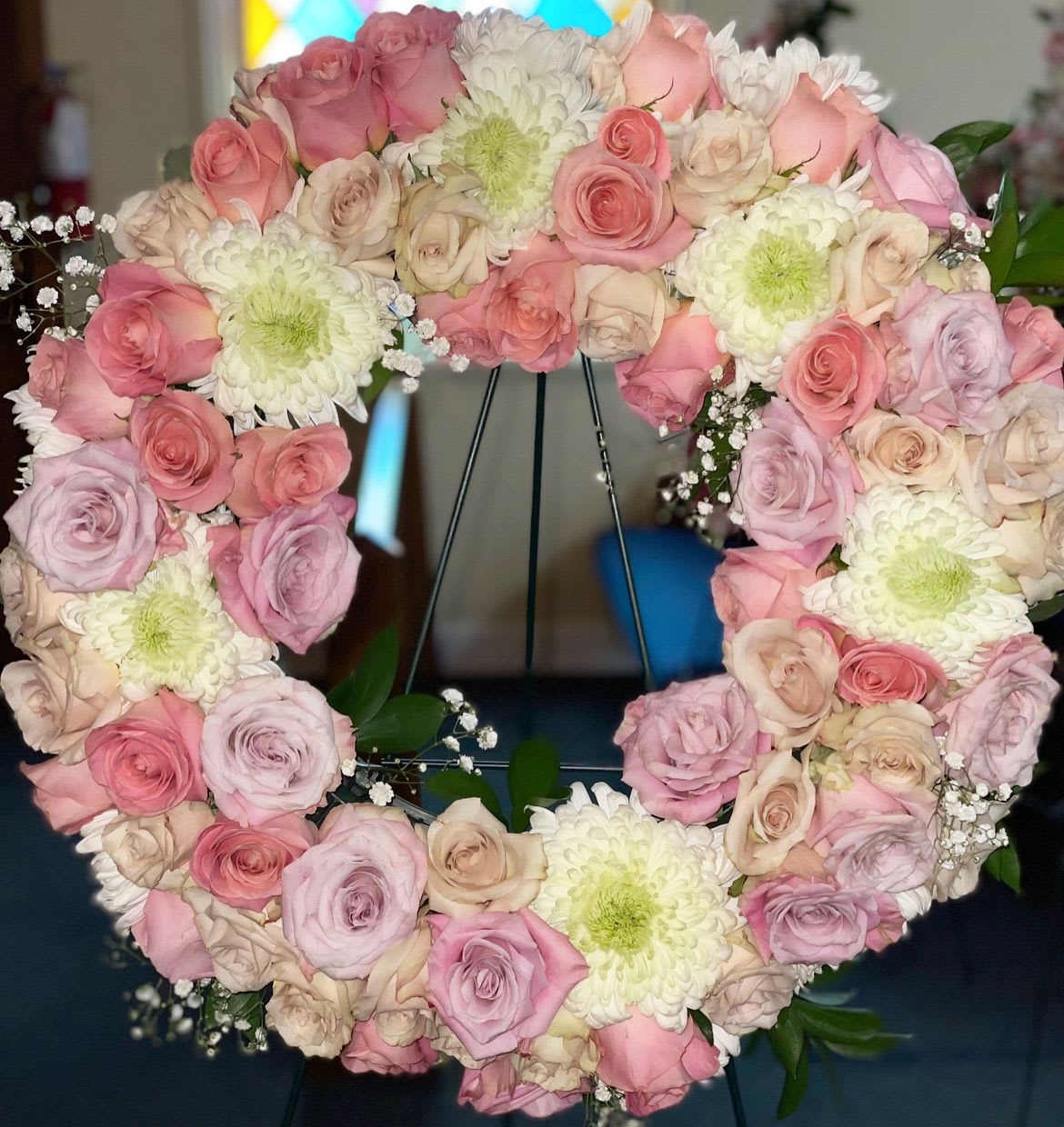 Peaceful Paradise Peaceful Paradise - We take pride in creating a perfect mix of beautiful roses and China mums for you.