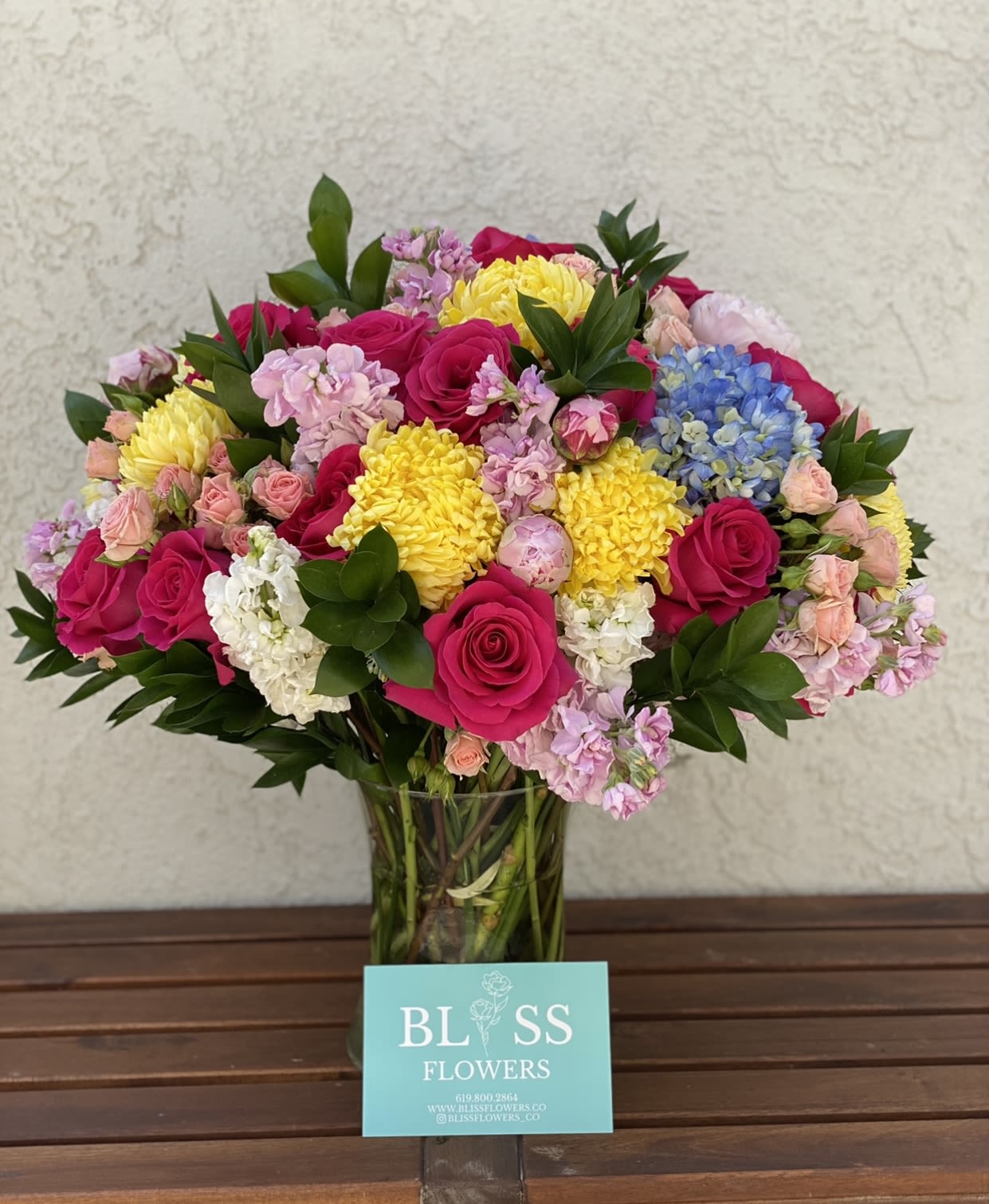 You deserve it Beautiful You deserve it Beautiful - A colorful assortment of vibrant flowers that is artfully arranged in a vase that Mom will be thrilled to enjoy