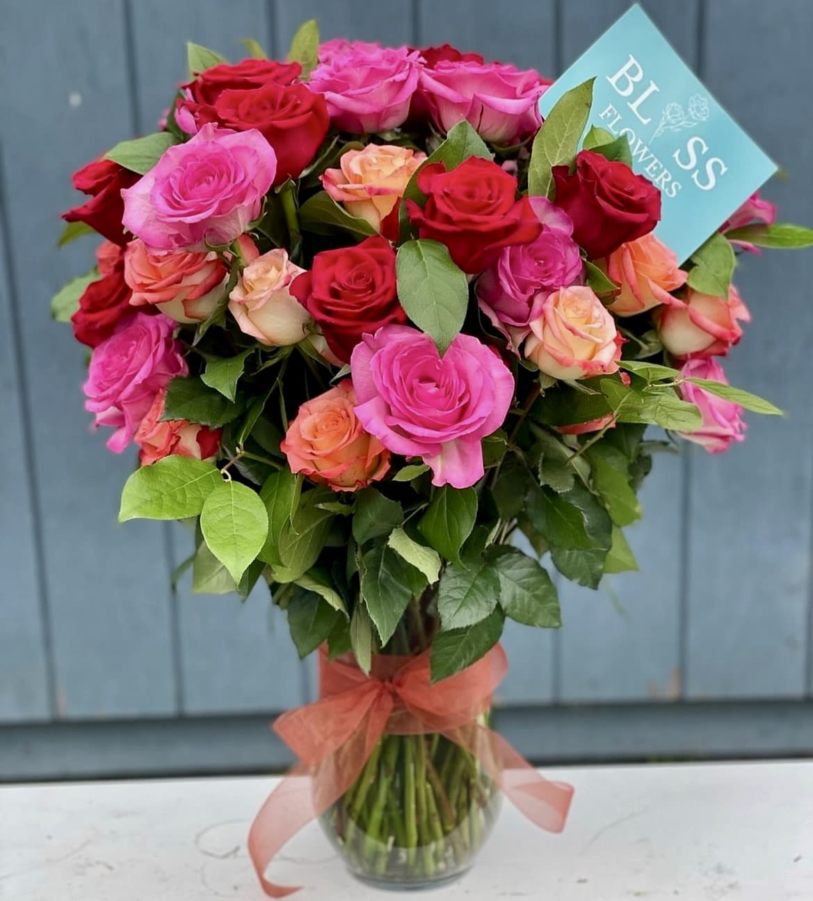 The swing of spring 75 roses The swing of spring 75 roses - This colorful assorted arrangement is a wonderful splash of color and is sure to bring happiness to anyone who receives it.