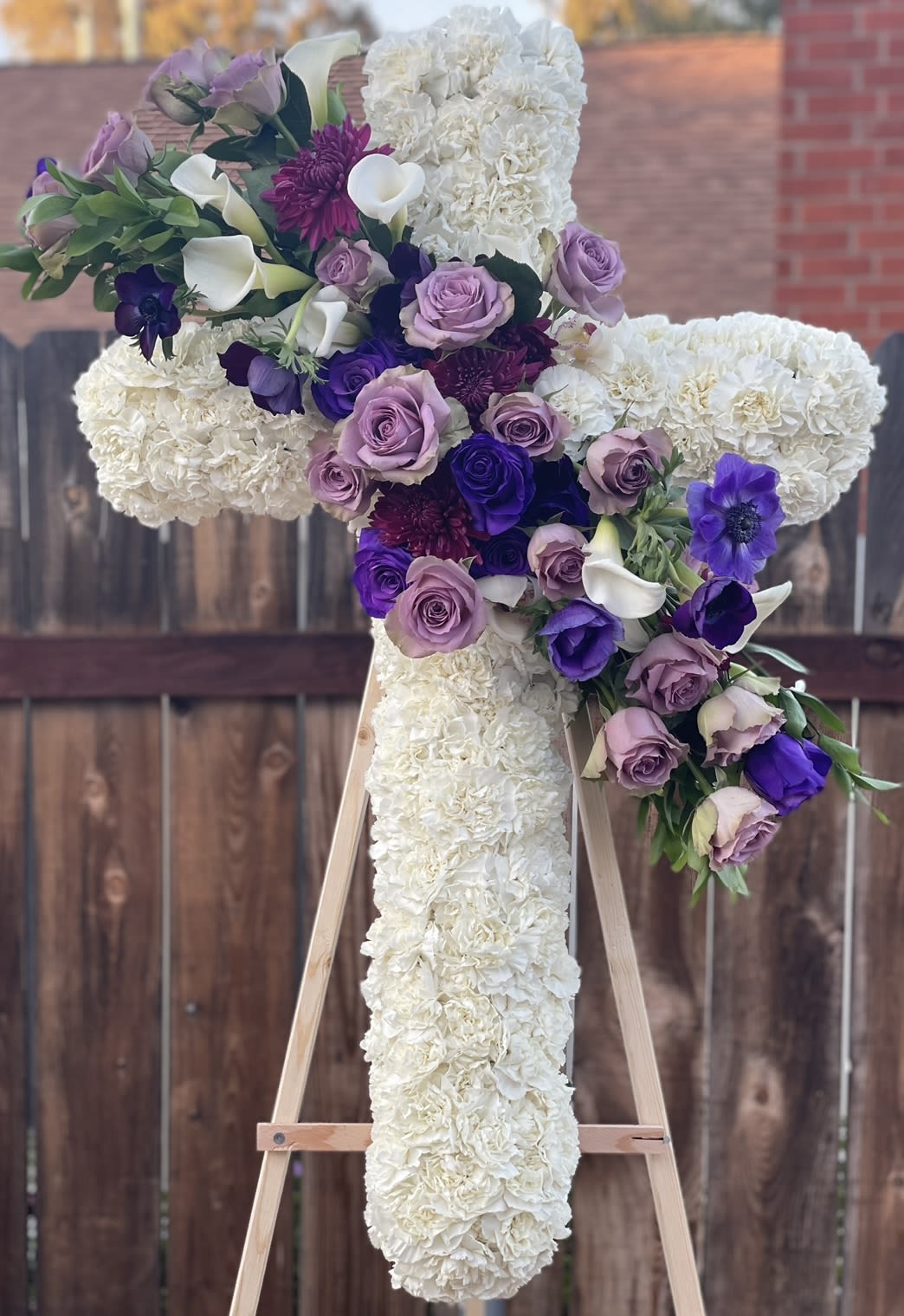 Memories are timeless treasures Memories are timeless treasures - This cross is unique with the anemone's and other specialty roses.