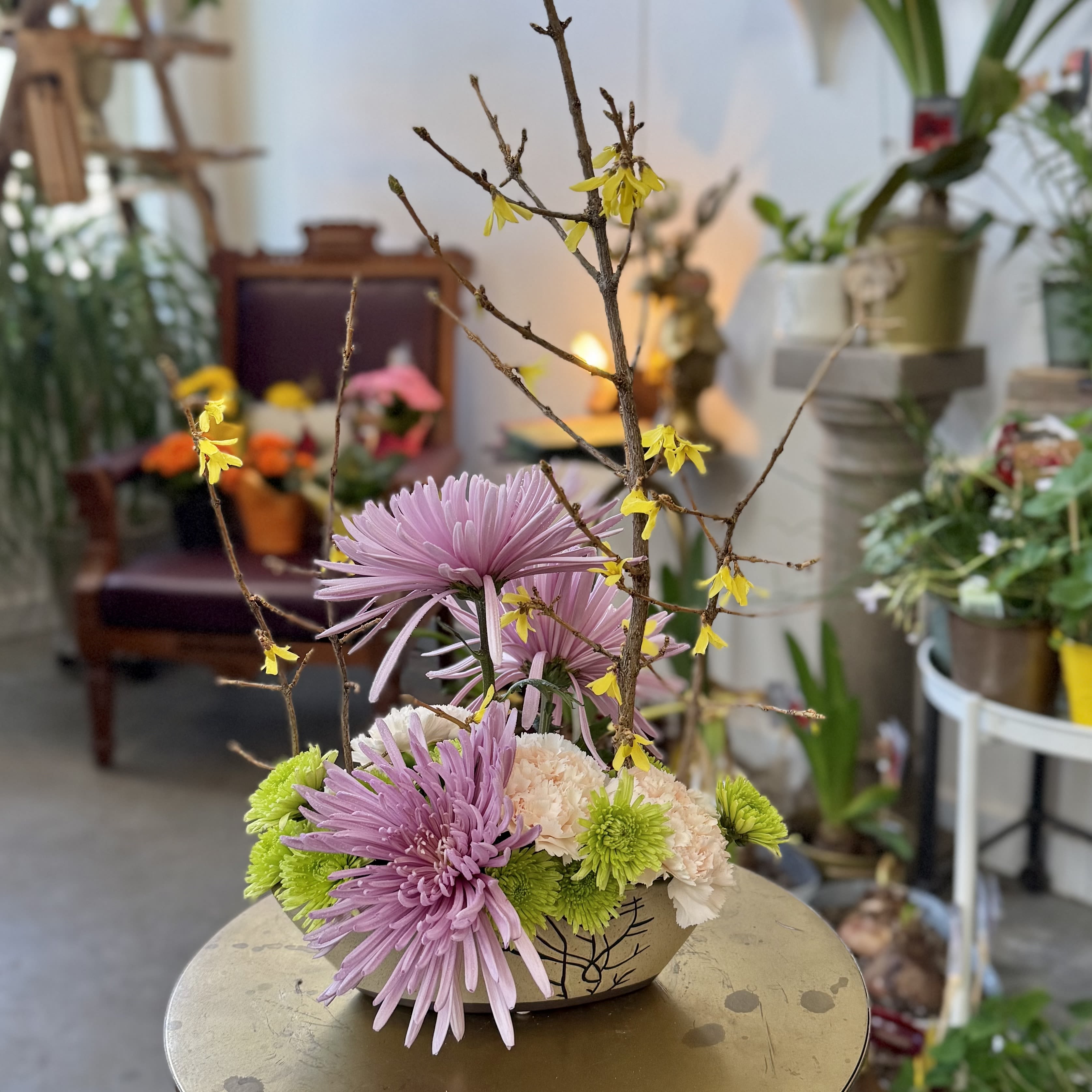 Bloom Boat Bloom Boat - A boat shaped ceramic dish is gilled to the brim with forced branches and spring toned blooms.
