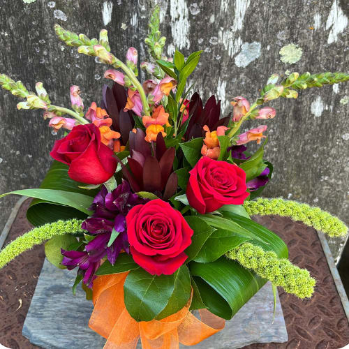 Joy Joy - There are a lot of things you don’t want overflowing. Your basement. Most rivers. Your basement again. This arrangement, on the other hand, is overflowing with beautiful flowers, and it’s a wonderful thing to behold. If you want to put an abundance of joy in your life, or the life of a loved one, this arrangement is overflowing with it!
